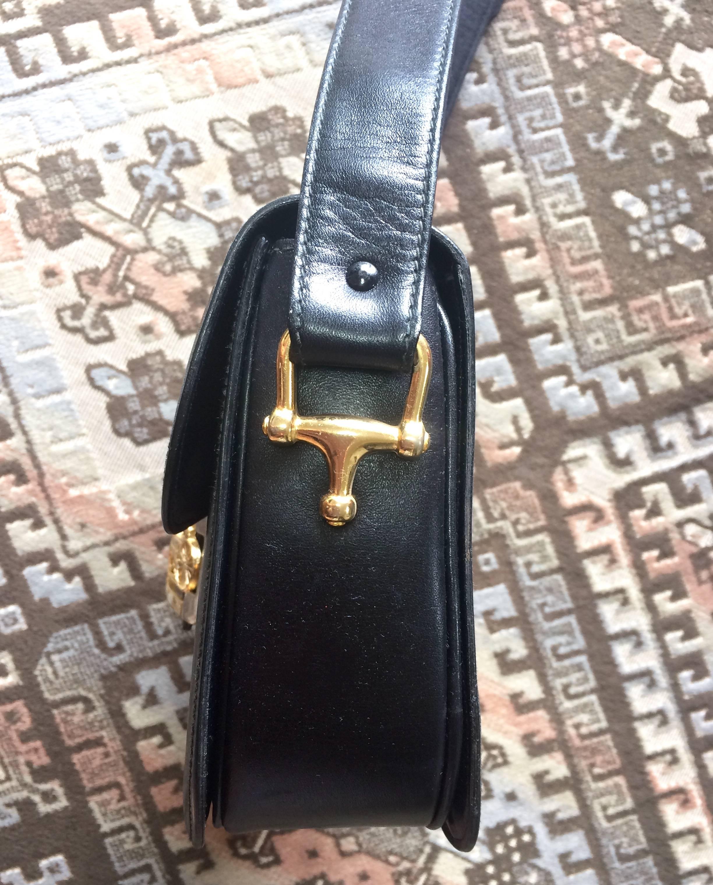 Vintage Celine black leather classic shoulder bag with golden logo closure. 2
