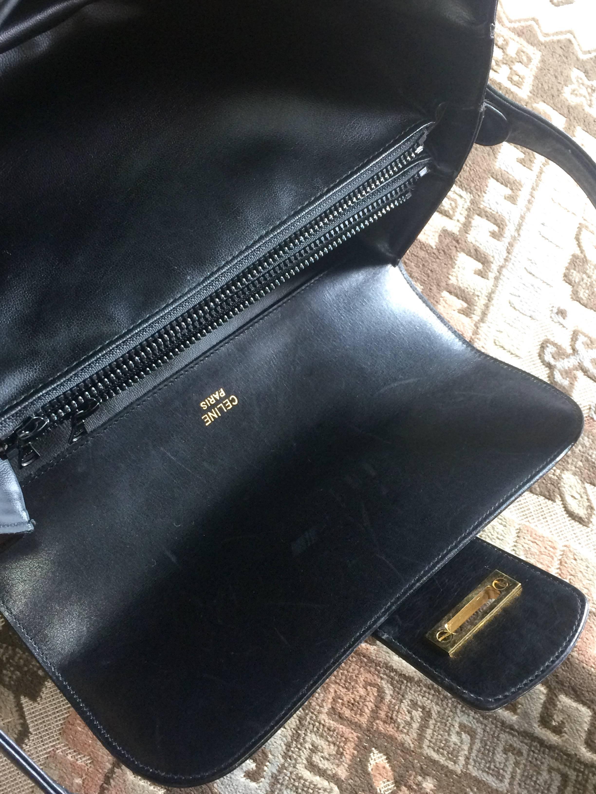Vintage Celine black leather classic shoulder bag with golden logo closure. 4