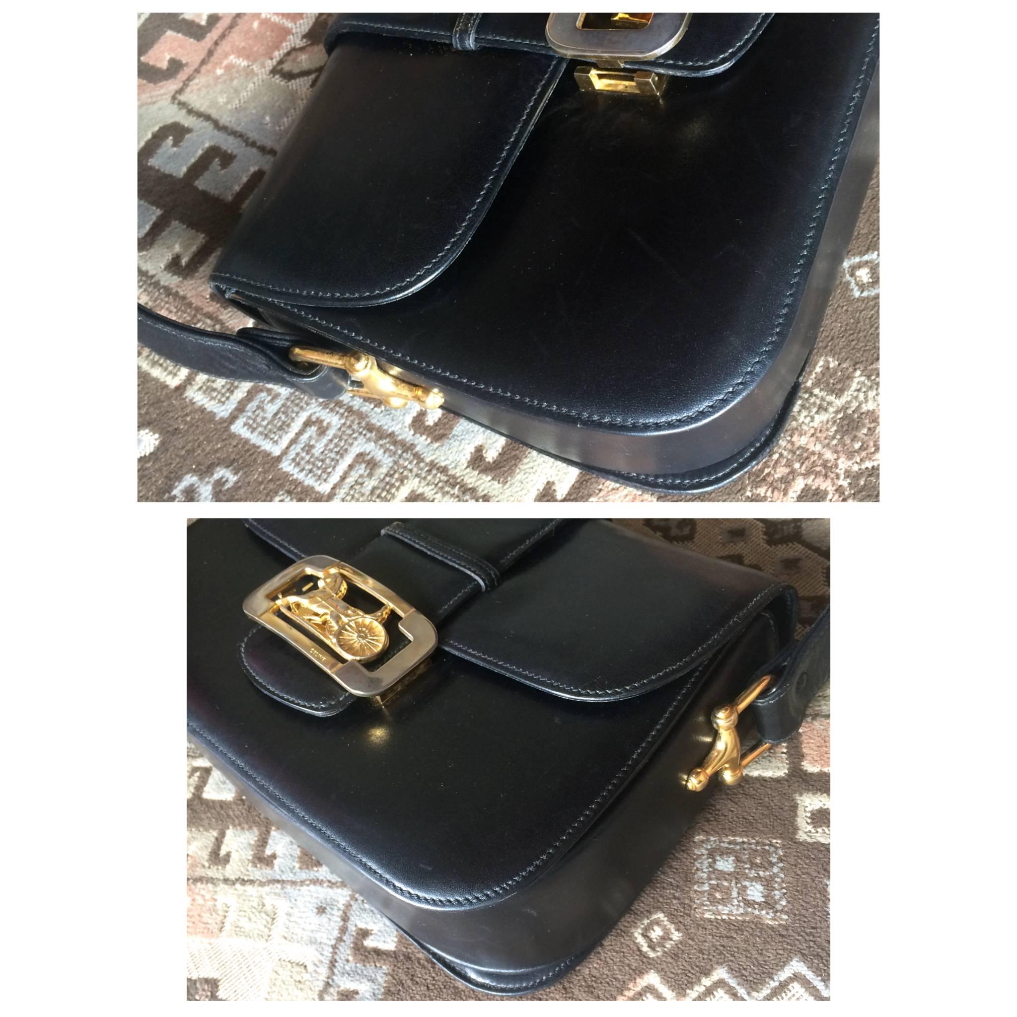 Vintage Celine black leather classic shoulder bag with golden logo closure. 1