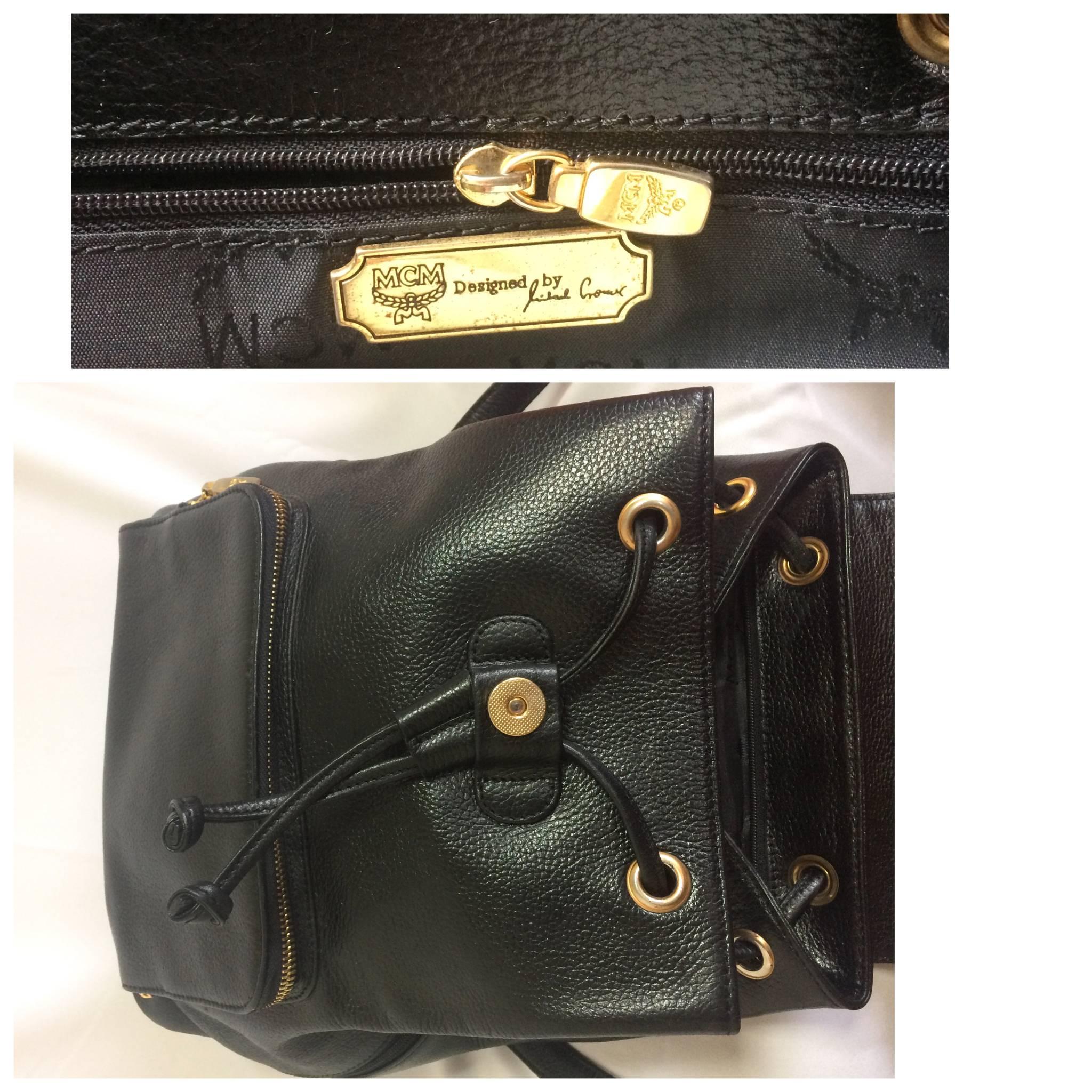 Vintage MCM black backpack with golden studded logos. Designed by Michael Cromer For Sale 1