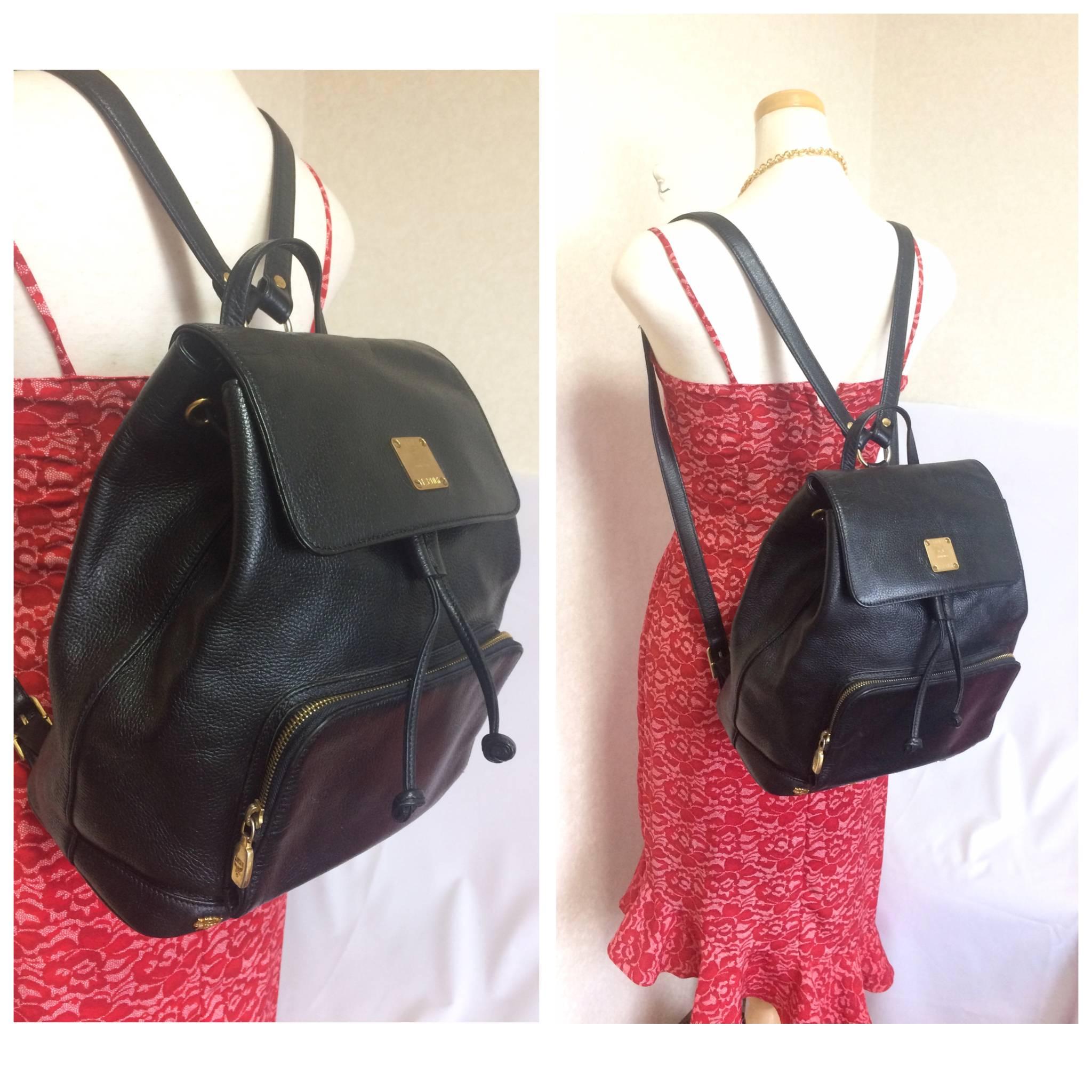 Vintage MCM black backpack with golden studded logos. Designed by Michael Cromer For Sale 2