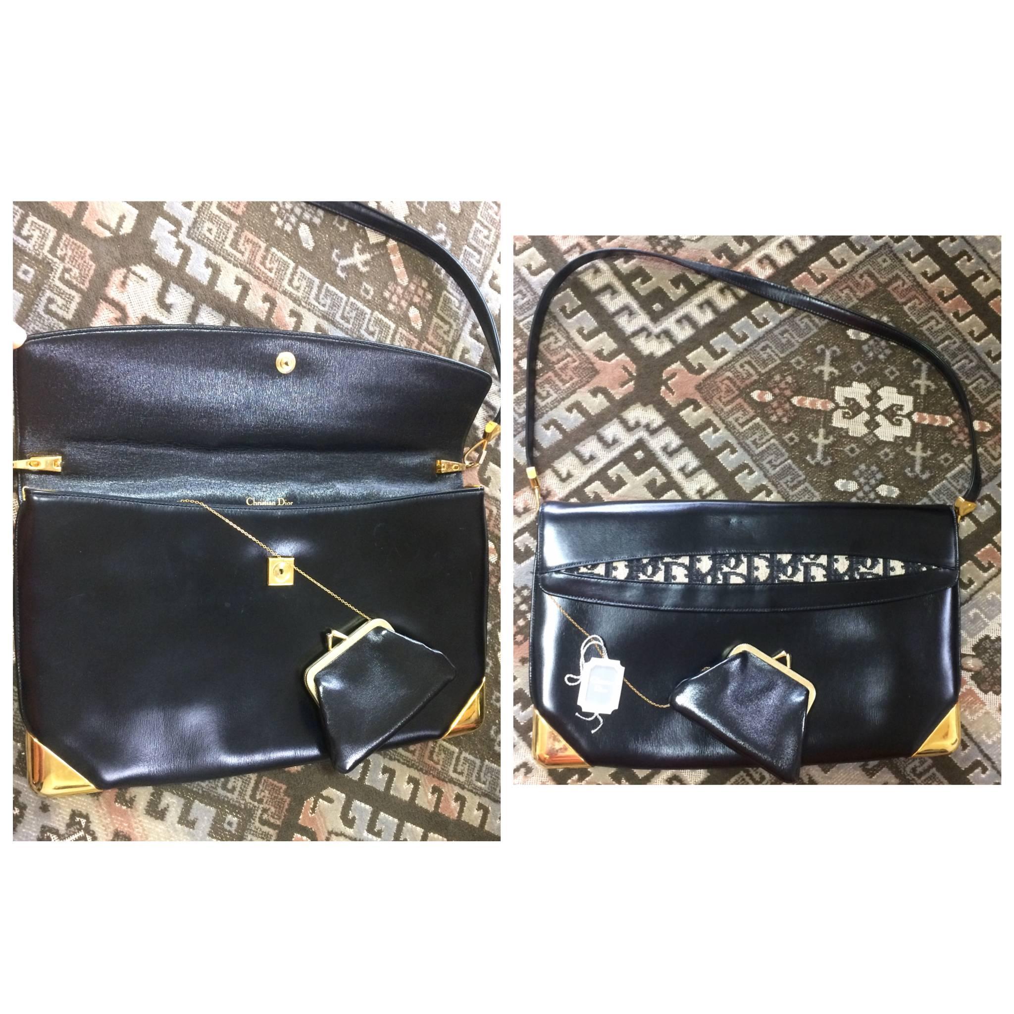 1980s. Vintage Christian Dior black leather large clutch purse, shoulder bag with navy trotter jacquard and golden frames. Comes with coin case.

This is a  Christian Dior genuine black calfskin classic large clutch shoulder bag, featuring golden