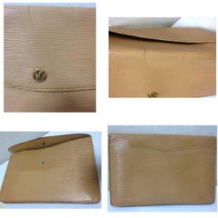 Vintage Louis Vuitton cream yellow epi envelope style clutch with gold tone LV.