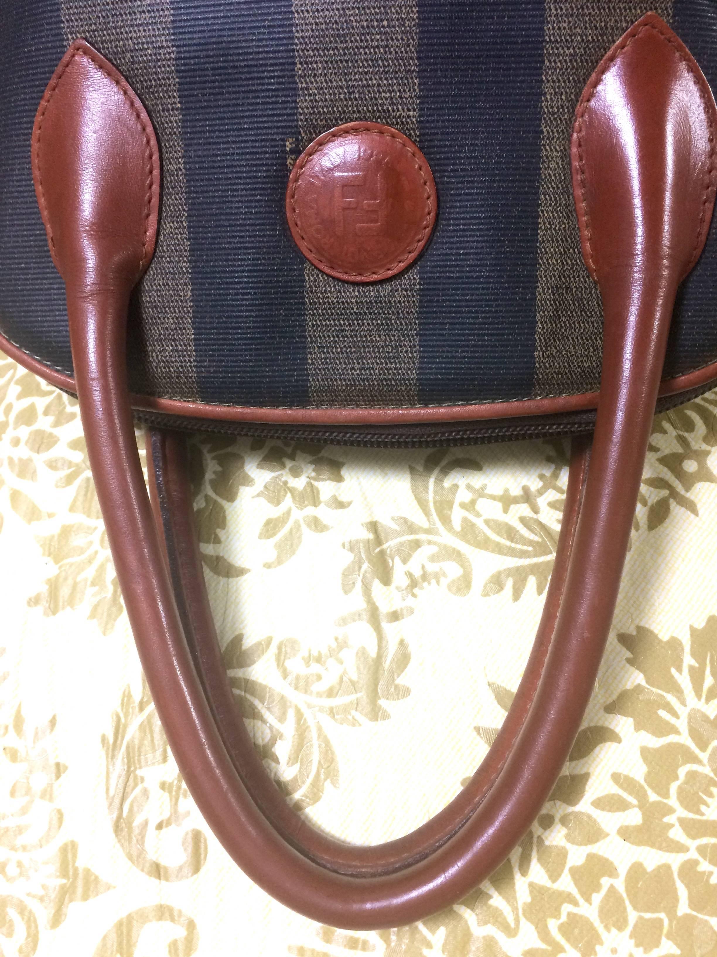 Brown Vintage FENDI black and grey pecan stripe bolide shape bag with brown handles. For Sale