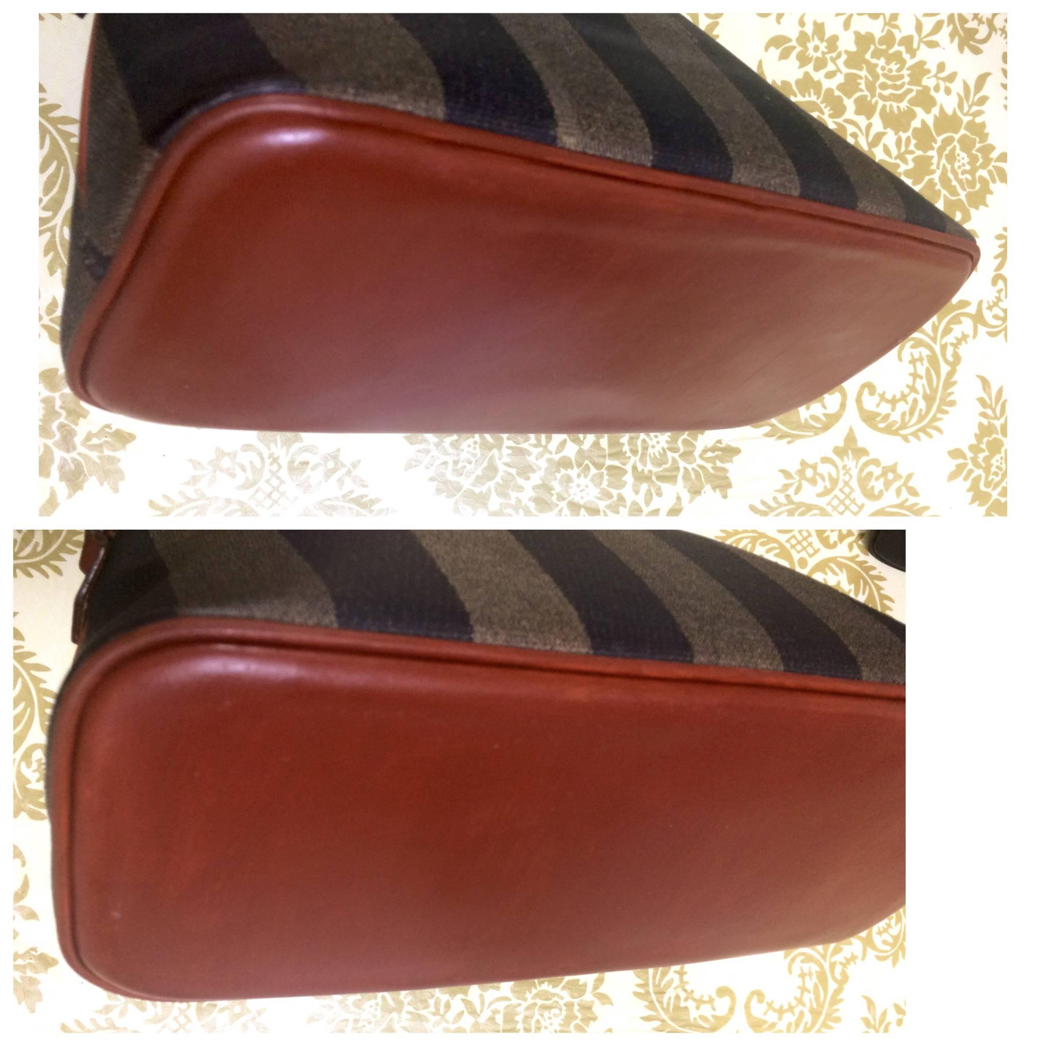 Women's Vintage FENDI black and grey pecan stripe bolide shape bag with brown handles. For Sale