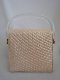Bally Vintage pearl pink lamb quilted leather purse with clear plastic handle.