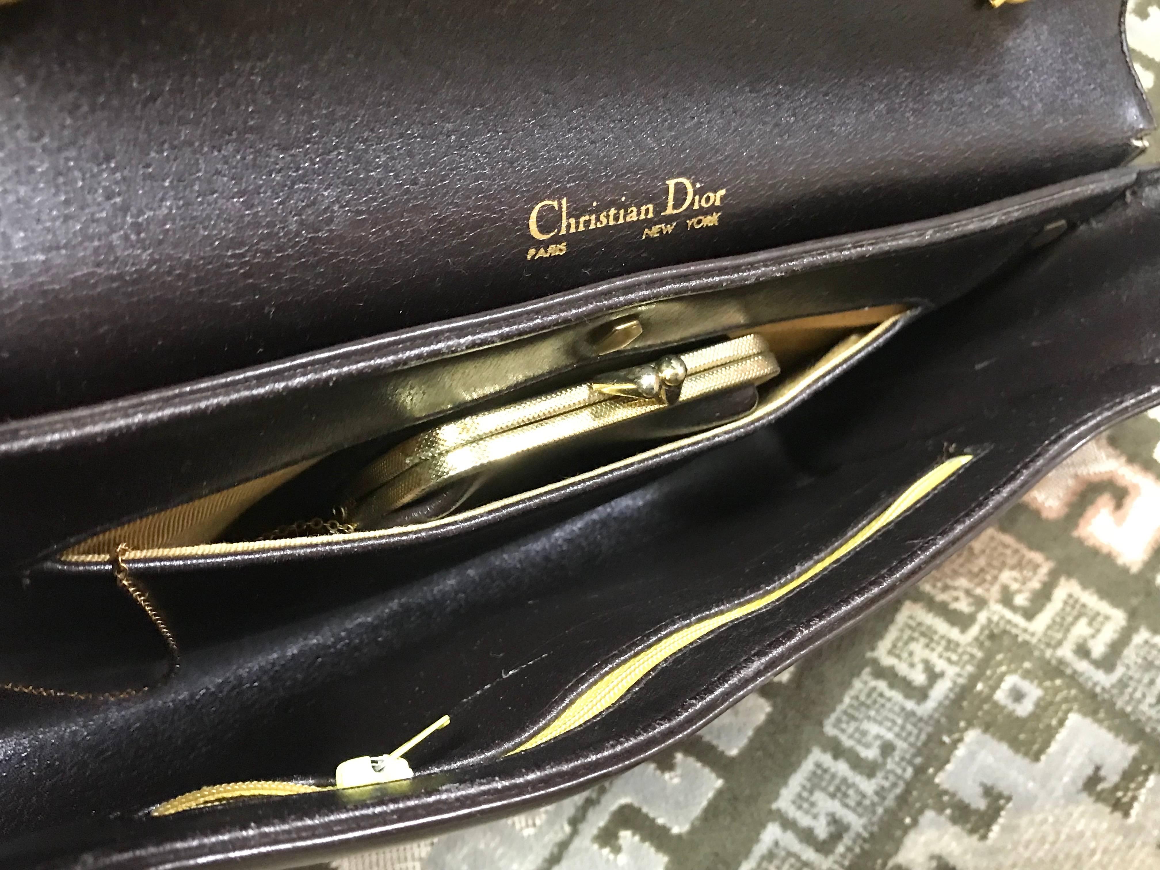 Vintage Christian Dior dark brown leather shoulder bag with CD motif and strap. For Sale 1