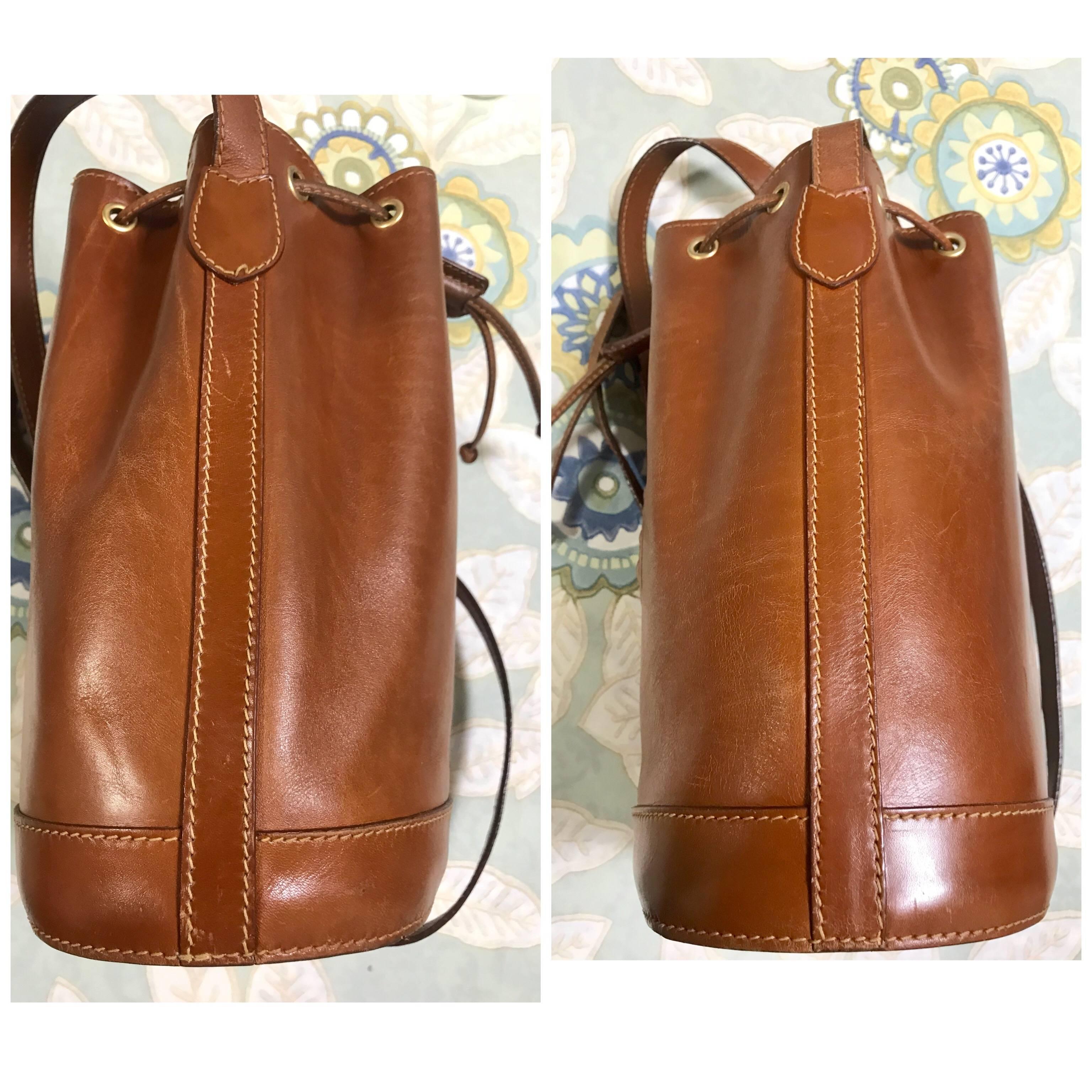 Brown Vintage FENDI brown leather hobo bucket, shoulder bag with drawstring and Janus.