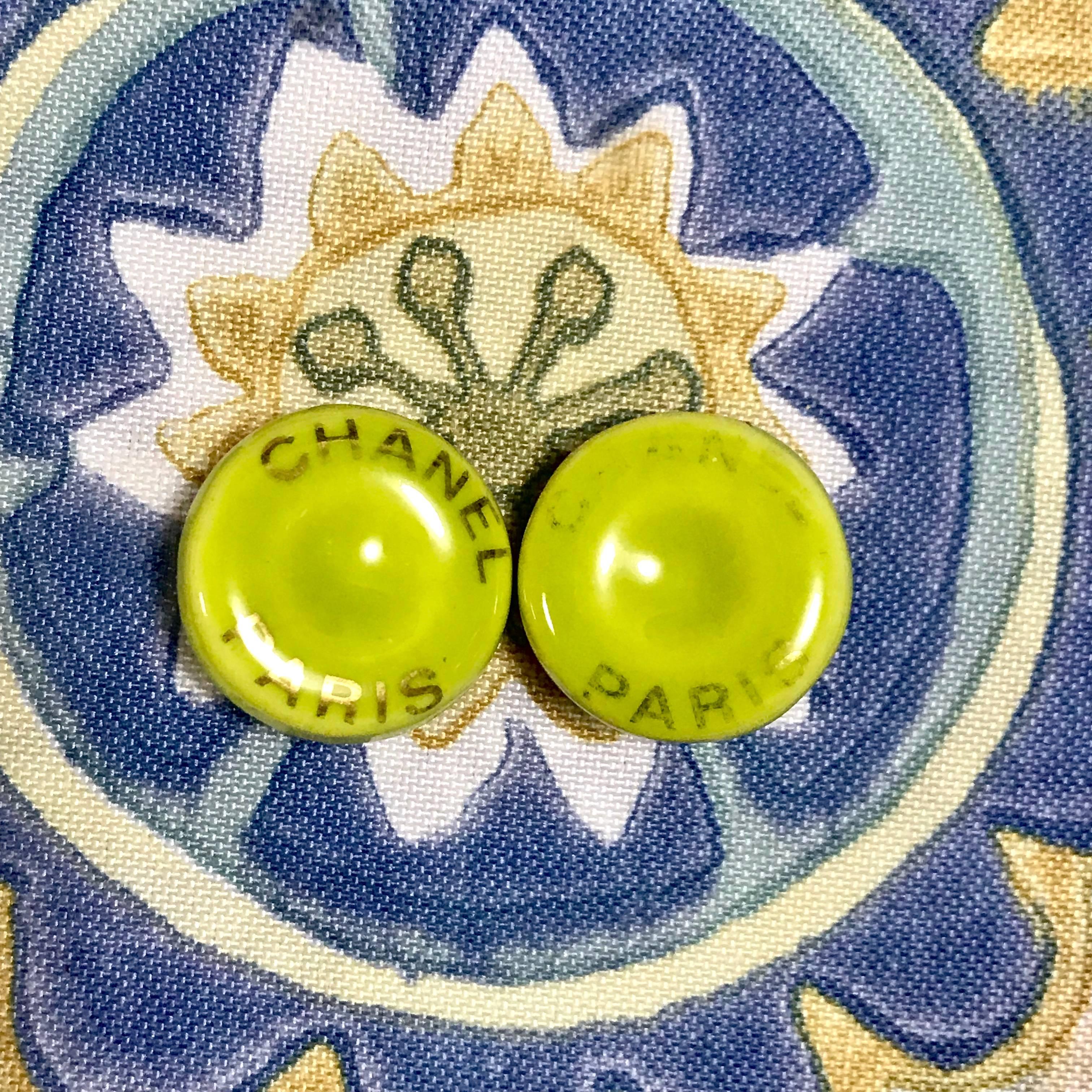 1990s. Vintage CHANEL yellow green, lime color and gold tone round button candy earrings. Perfect Chanel jewelry for any seasons.

Fun and Chic and Gorgeous CHANEL earrings for you or your loved one! 
Great gift idea. 

Introducing a pair of unique
