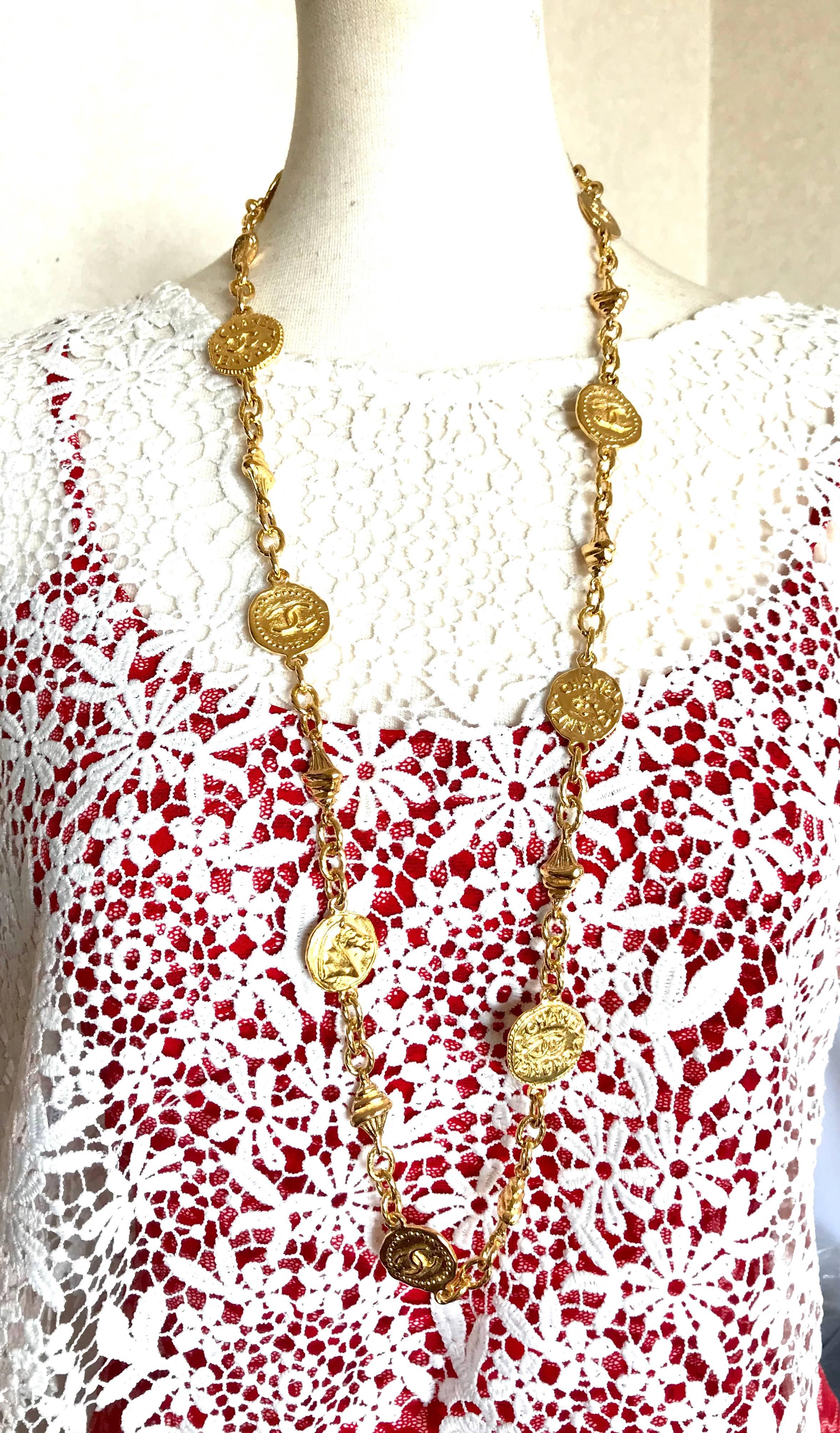 1980s. Vintage CHANEL golden long chain necklace with CC mark, button, Greek man symbol, and horse coin, medal motifs. Can be worn in double and as a belt as well. 
Perfect and gorgeous Chanel gift.

Here is another classic jewelry piece from Chanel