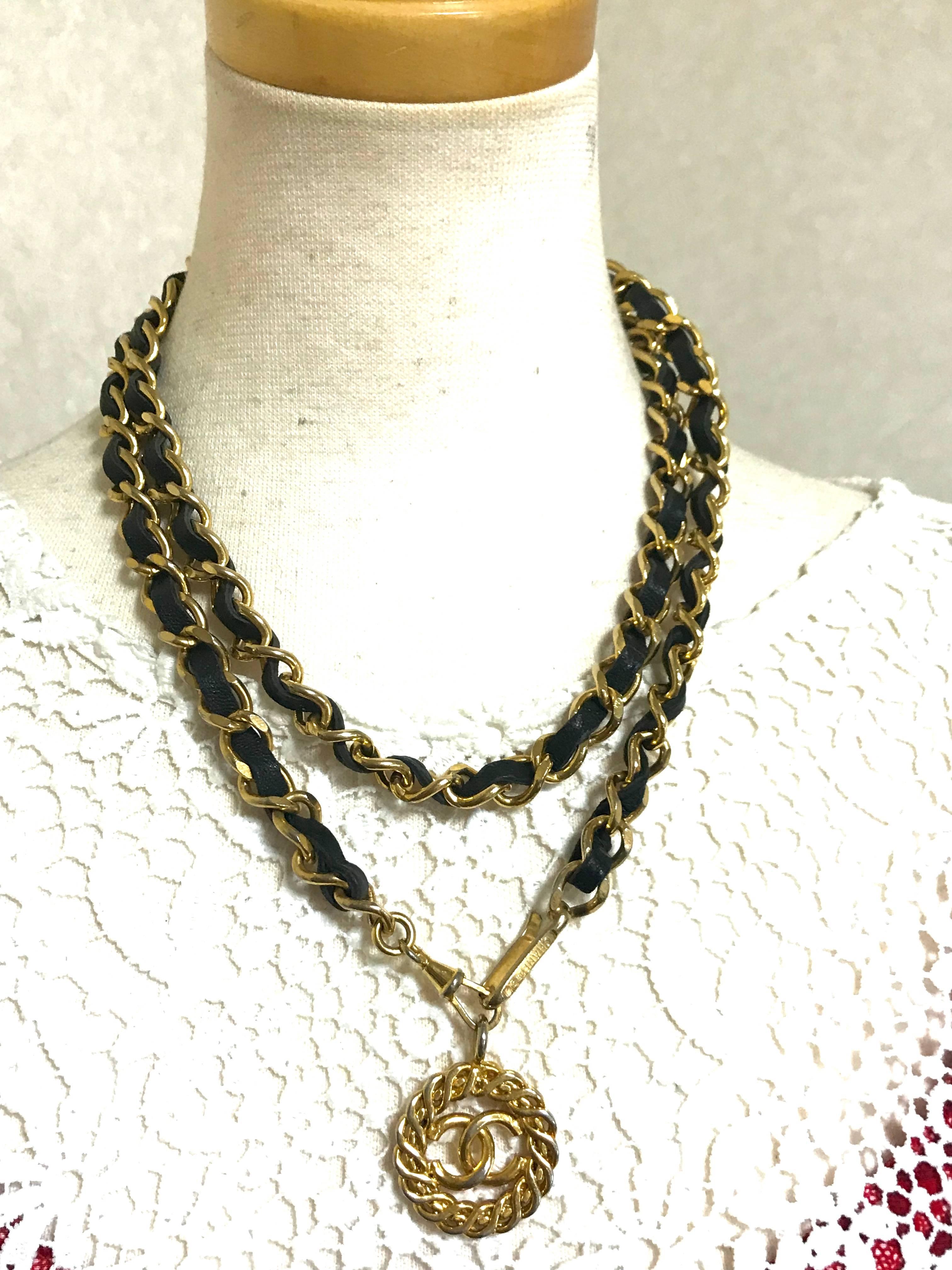 Black Vintage CHANEL golden chain and black belt/necklace with flower CC mark charm. 