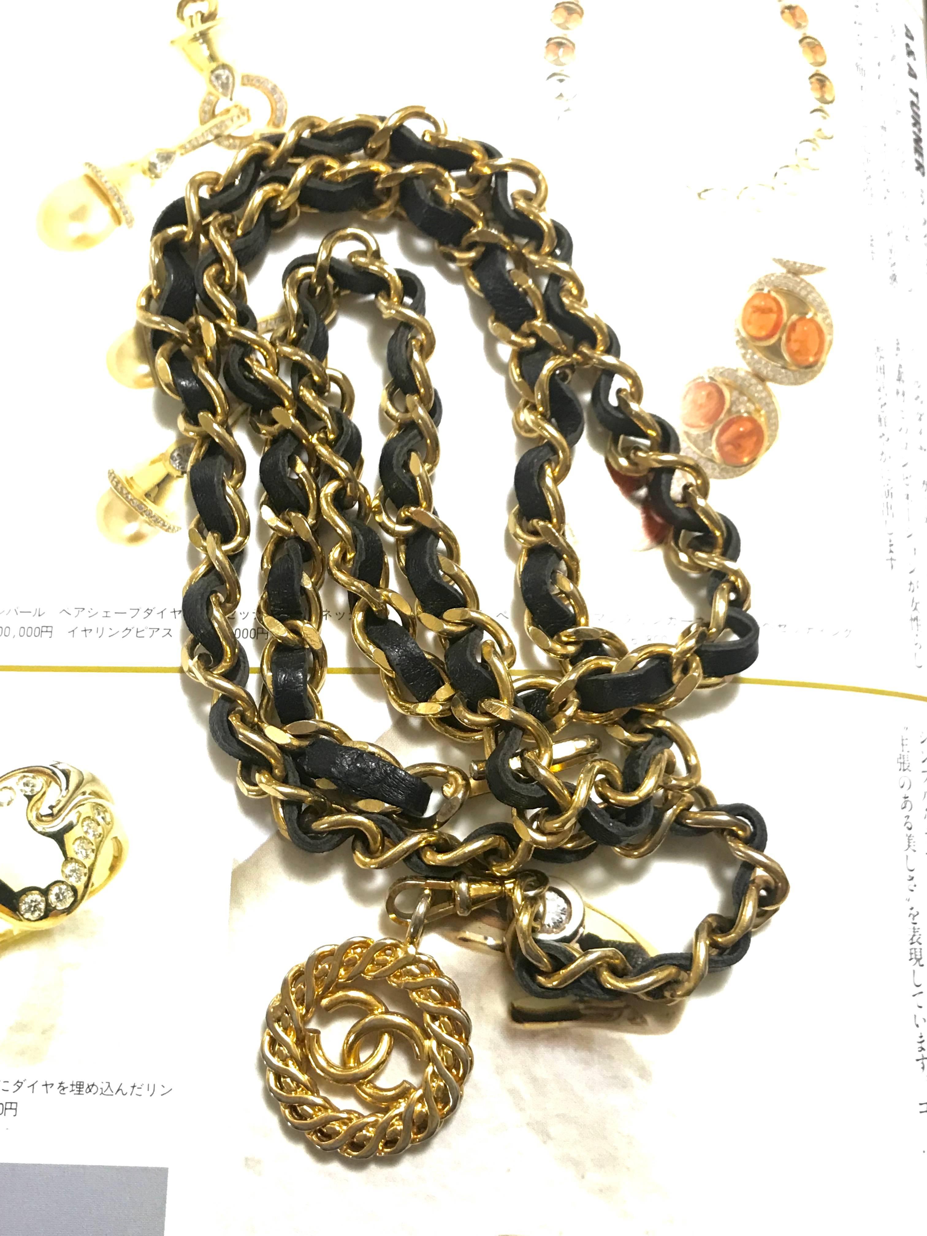 Women's Vintage CHANEL golden chain and black belt/necklace with flower CC mark charm. 