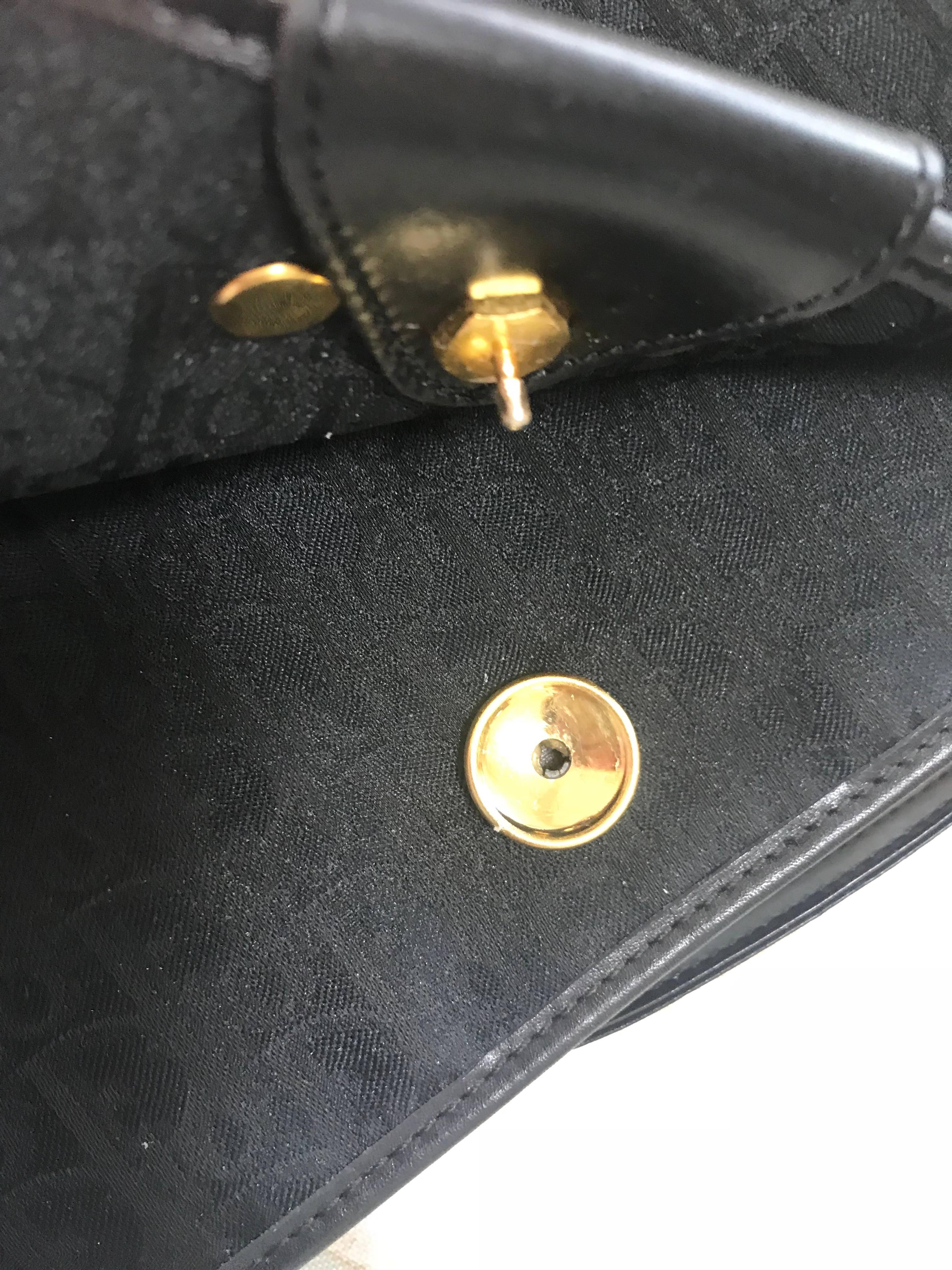 Vintage Christian Dior black logo jacquard shoulder bag, clutch with gold motif. For Sale 3