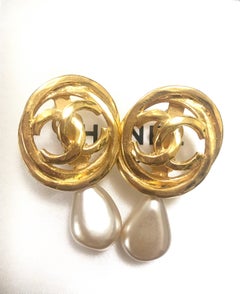 Vintage CHANEL golden layered hoop design earrings with CC and teardrop pearls.