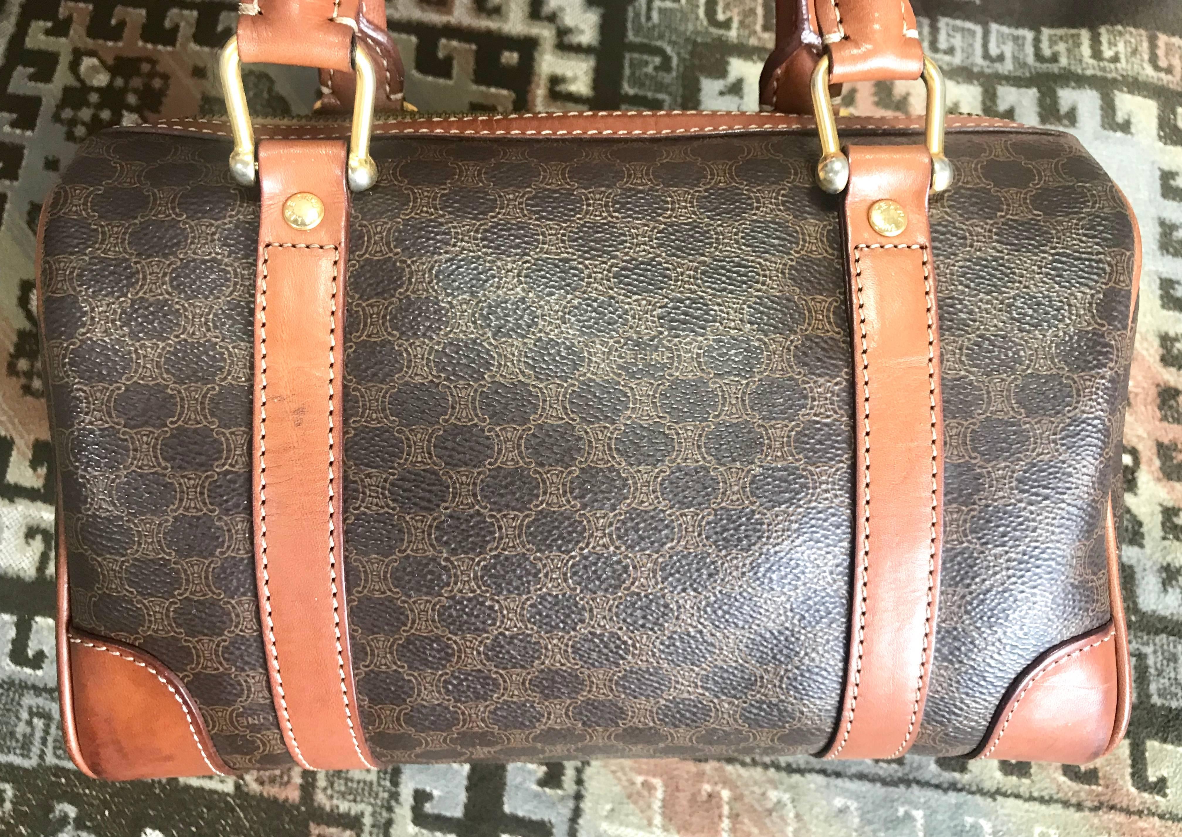 1990s. Vintage CELINE mini duffle bag, speedy style handbag with macadam blaison pattern and brown leather trimmings. Perfect daily use bag.

If you are looking for a classic mini duffle bag/speedy design handbag for daily use, this is the right one