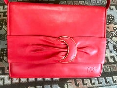 Vintage Valentino Garavani orange red leather clutch shoulder bag with buckle.