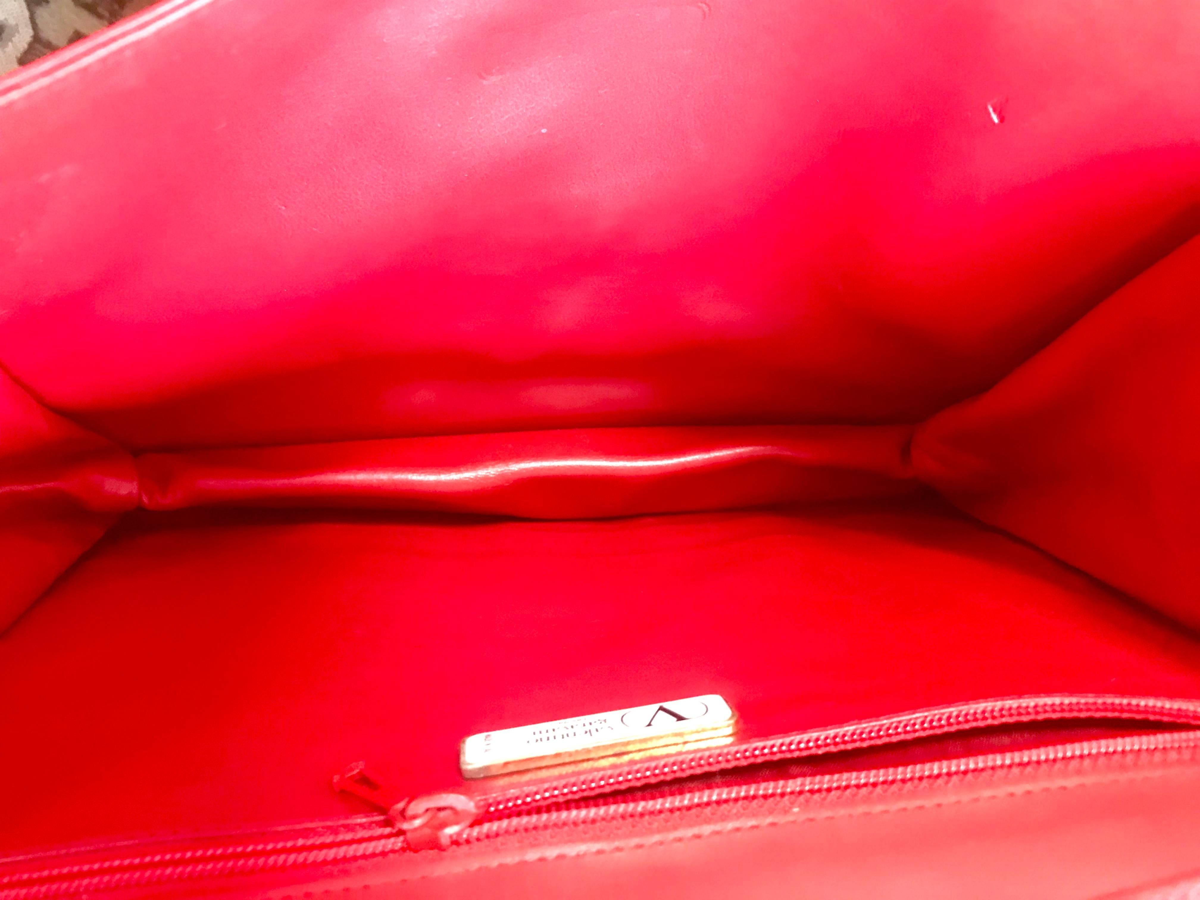 Women's Vintage Valentino Garavani orange red leather clutch shoulder bag with buckle. For Sale