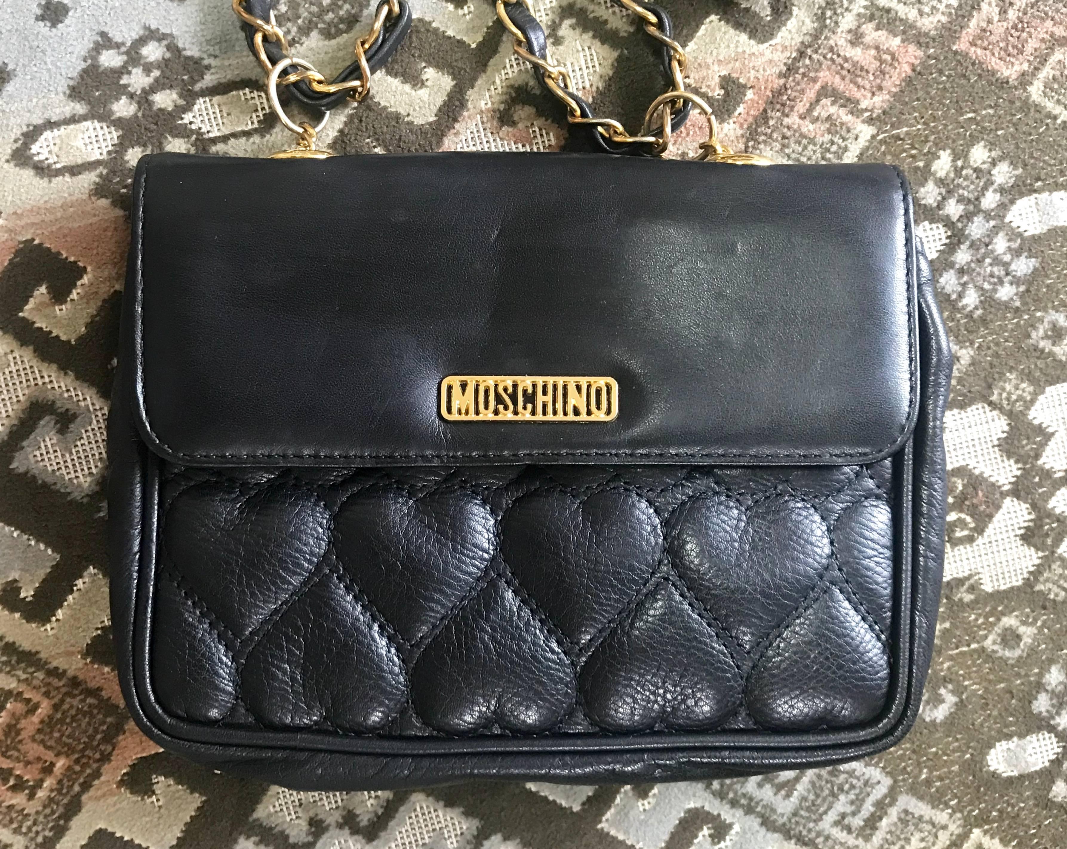 1990s. Vintage MOSCHINO black heart shape stitch lambskin shoulder bag with chain straps. Can be a fanny pack and clutch handbag as well.

****The white version is also available***

Introducing a chic and cute vintage piece from Moschino back in