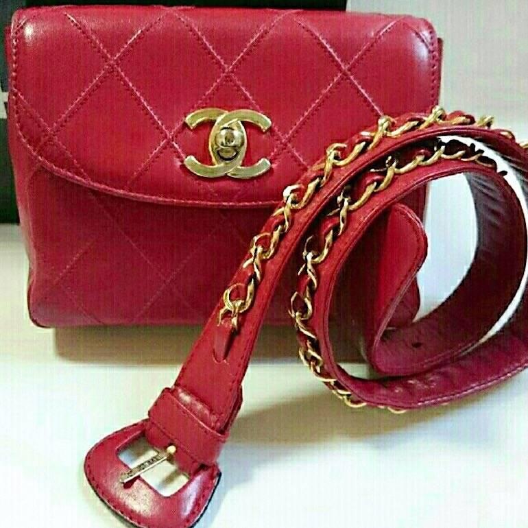 1990s. Vintage CHANEL lipstick red leather waist bag, fanny pack with detachable chain belt and cc closure. Belt size would fit 23.2