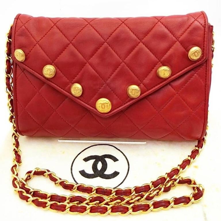 Chanel Vintage red lamb shoulder bag with golden CC button motifs