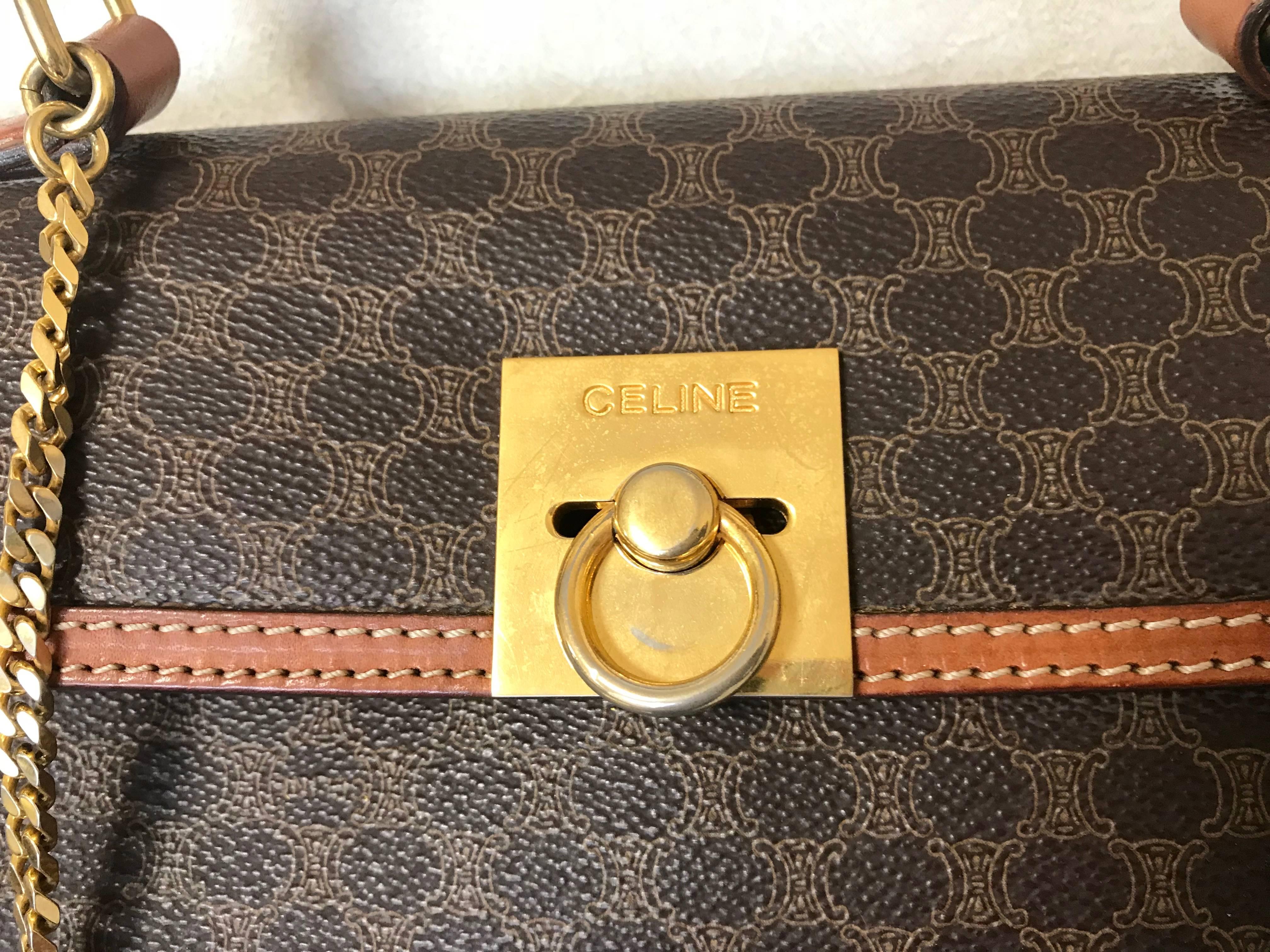 1990s. Vintage CELINE brown macadam blason logo printed Kelly style handbag with golden closure and chain. Classic purse. Perfect daily use bag.

Introducing another classic vintage masterpiece bag from CELINE back in the 90's. 
Featuring its iconic