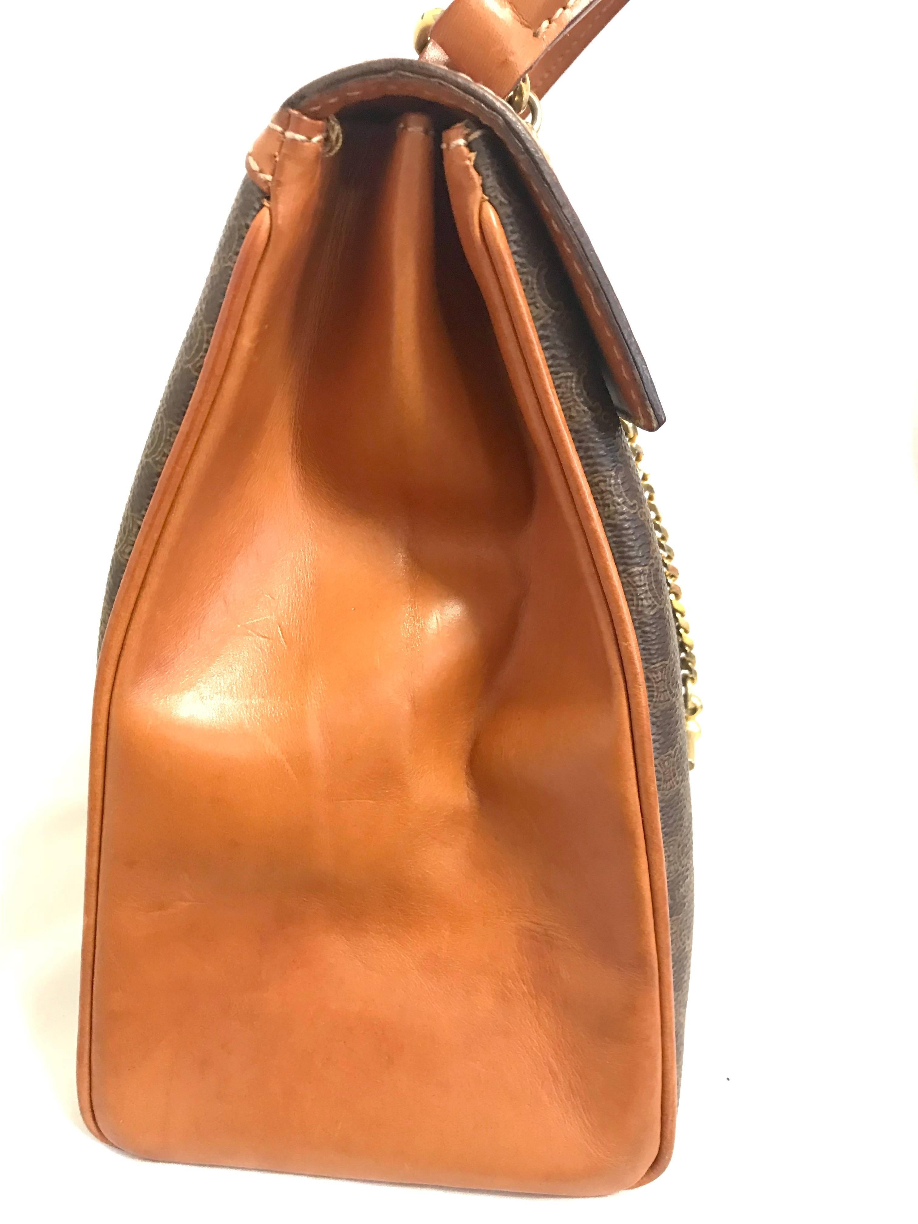 Vintage CELINE brown logo printed Kelly style handbag with golden closure. For Sale 1