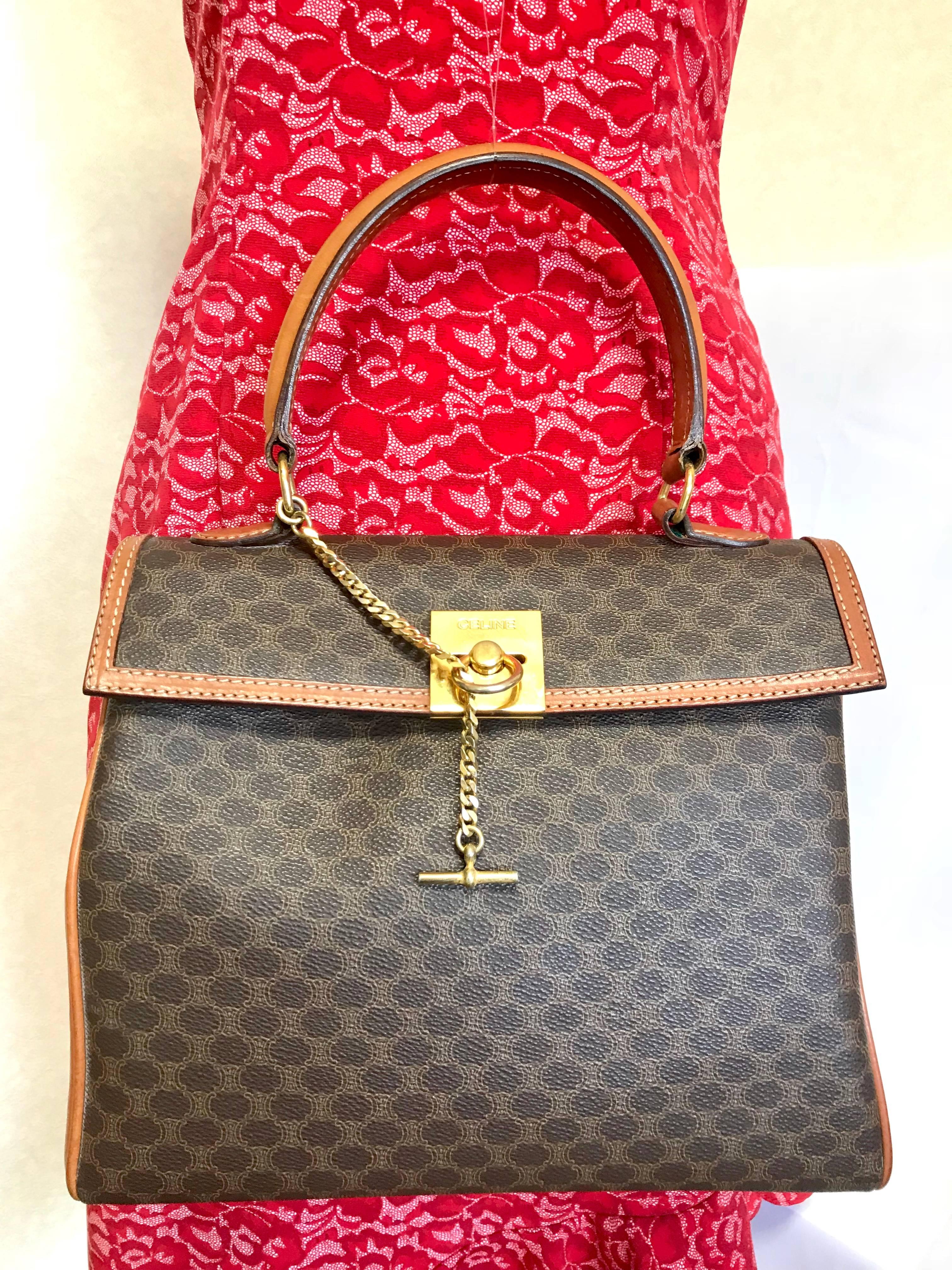 Vintage CELINE brown logo printed Kelly style handbag with golden closure. For Sale 9