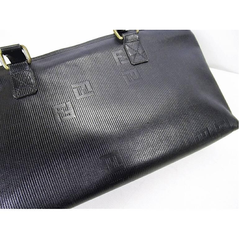 1970-1980s. Vintage FENDI black stripe gained leather shopper tote bag with FF logo embossed. Daily use purse for Unisex.

For all Fendi vintage lovers, this purse is the one for you!
Classic shape shoulder tote bag from FENDI back in the old era,