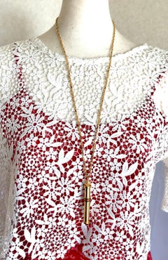 Vintage Gucci golden perfume bottle necklace with webbing, green and red color.