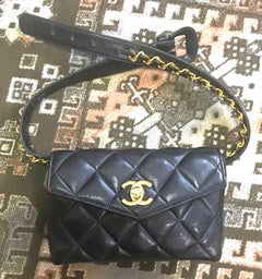 Vintage CHANEL black belt bag, fanny pack with golden chain belt and CC. 28”-30”