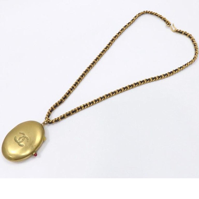 Vintage Chanel pill case design black leather and chain necklace with CC  mark. For Sale at 1stDibs | chanel pill box