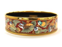 Vintage Hermes cloisonne enamel golden bangle with bird design.