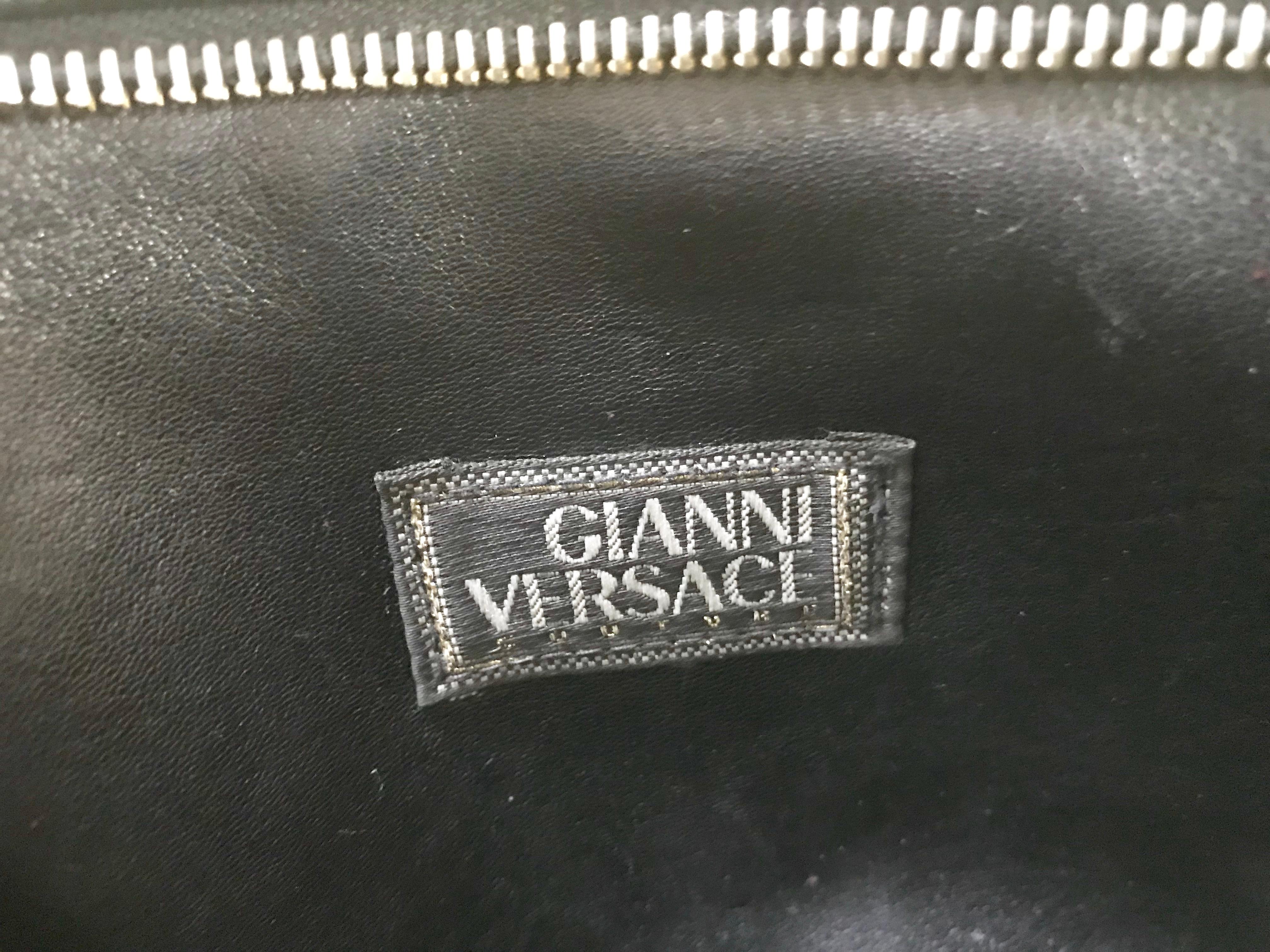 Women's or Men's Vintage Gianni Versace black leather clutch purse, pouch, case bag with medusa.