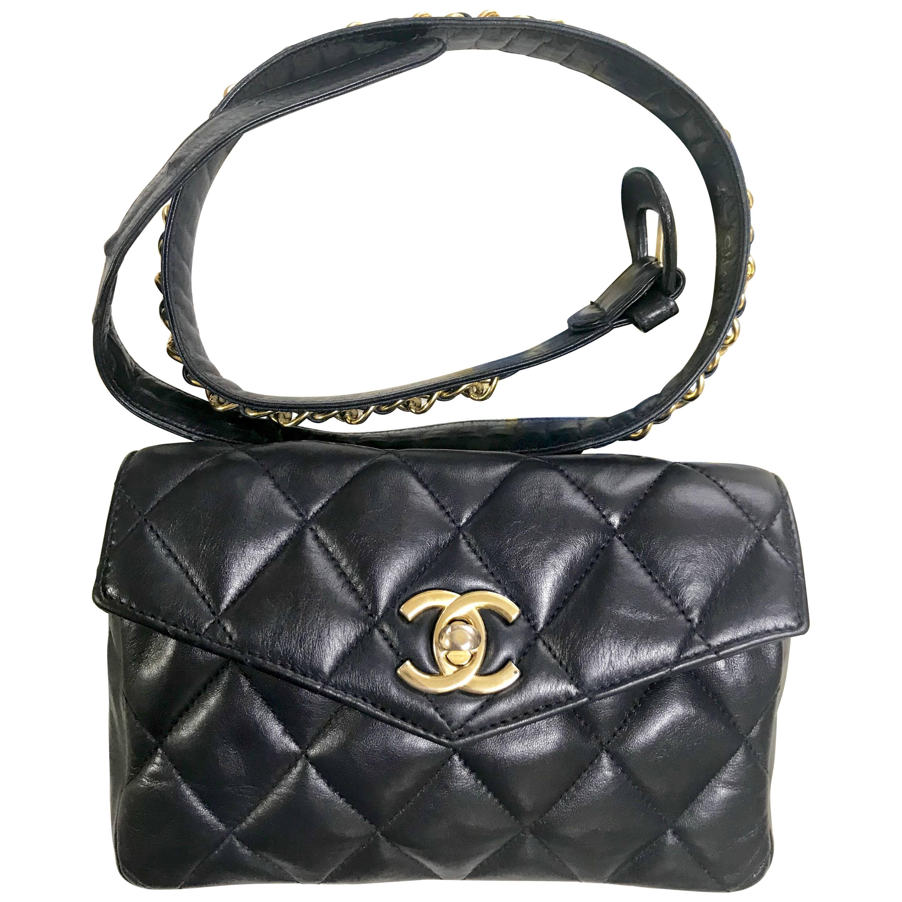 Vintage CHANEL dark navy lamb leather waist bag, fanny pack with golden chains. For Sale