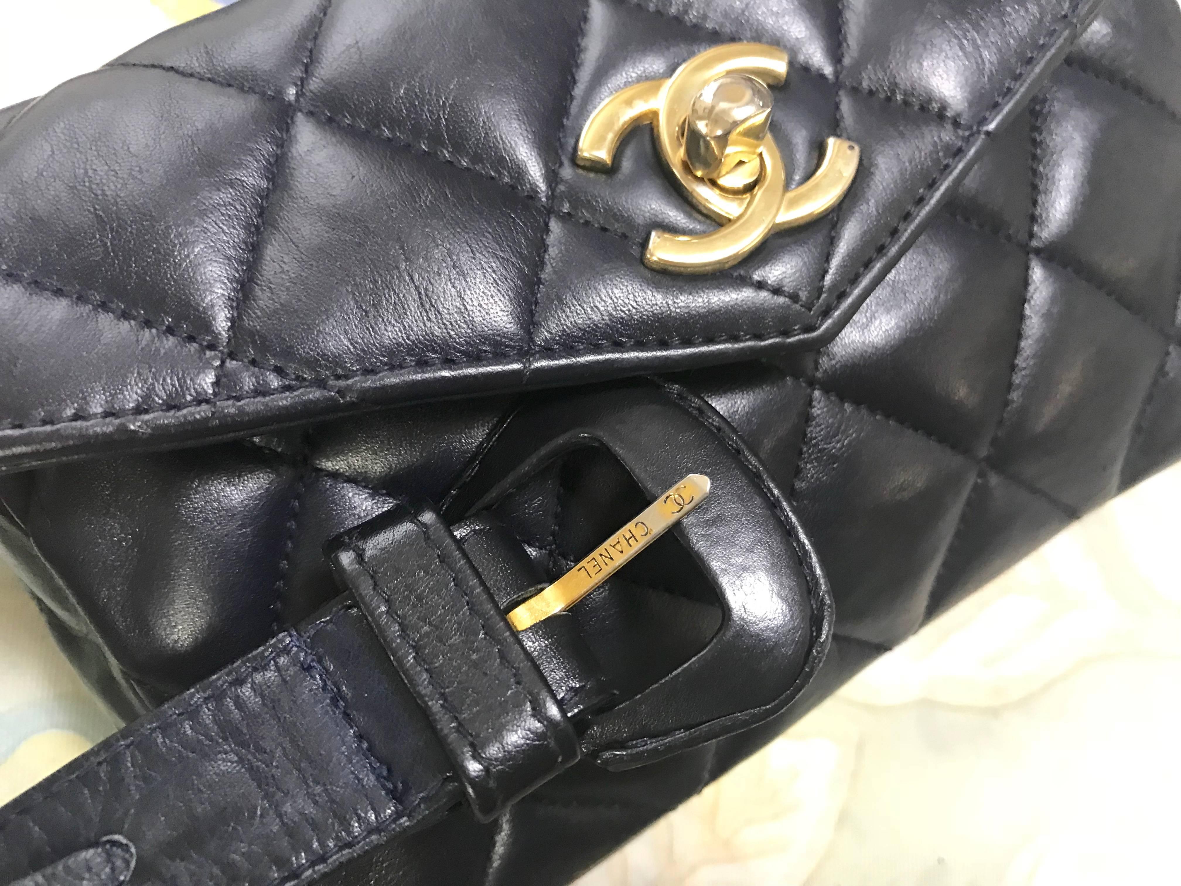 Vintage CHANEL dark navy lamb leather waist bag, fanny pack with golden chains. For Sale 1