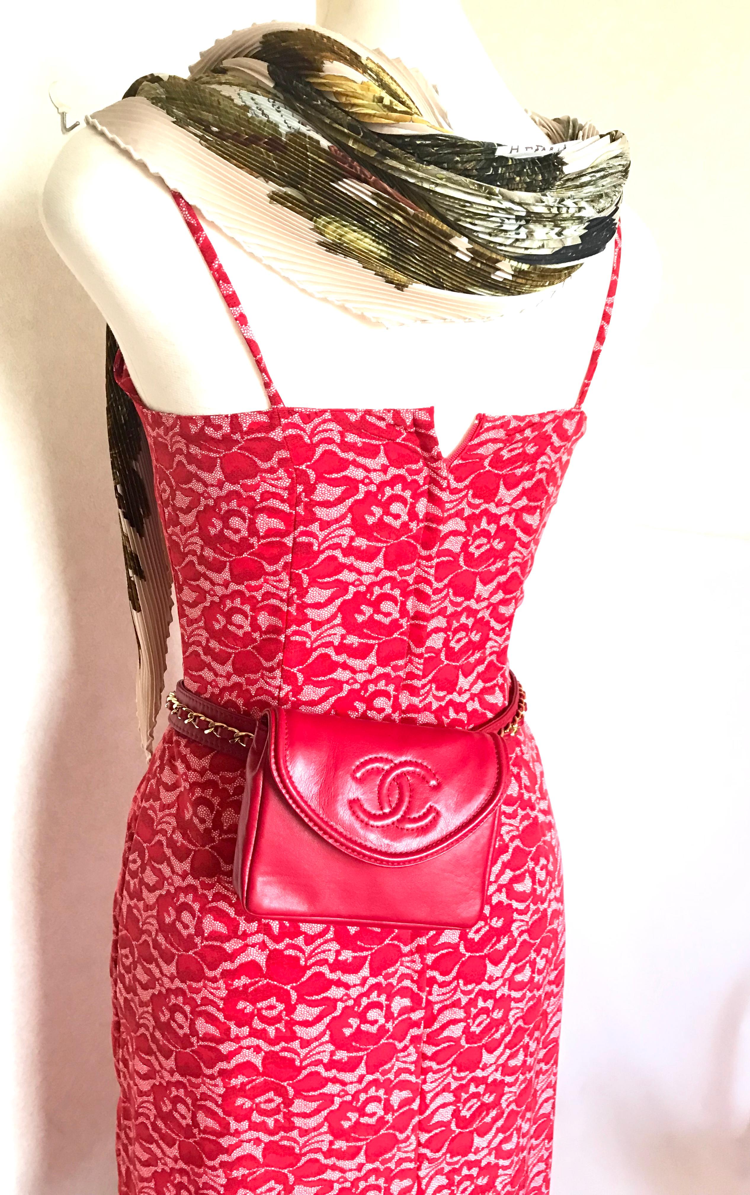 1980s. Vintage CHANEL lipstick red leather belt bag, fanny pack with detachable chain belt and CC stitch mark on flap. Belt size would fit 29.5