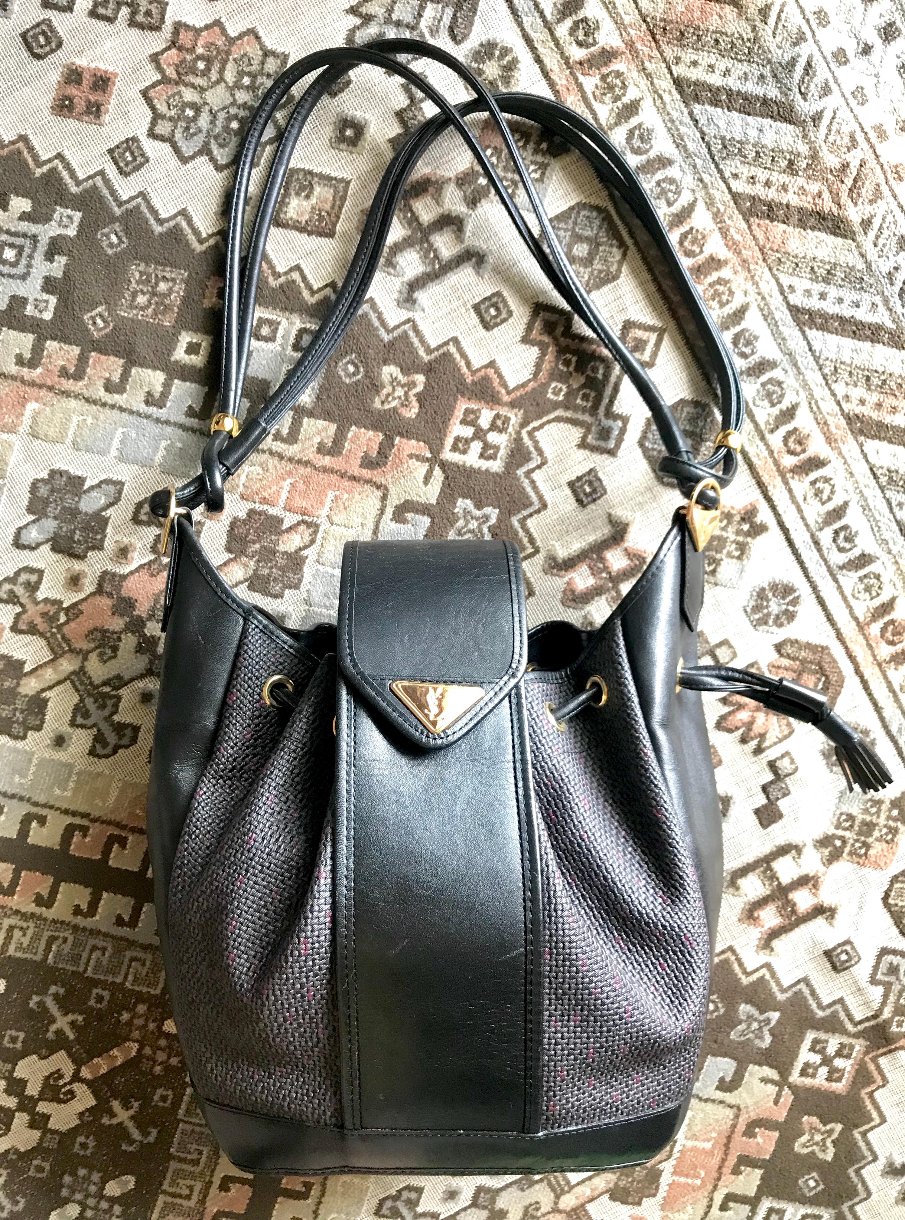 Yves Saint Laurent Vintage black hobo bucket shoulder bag with golden YSL motif For Sale 7