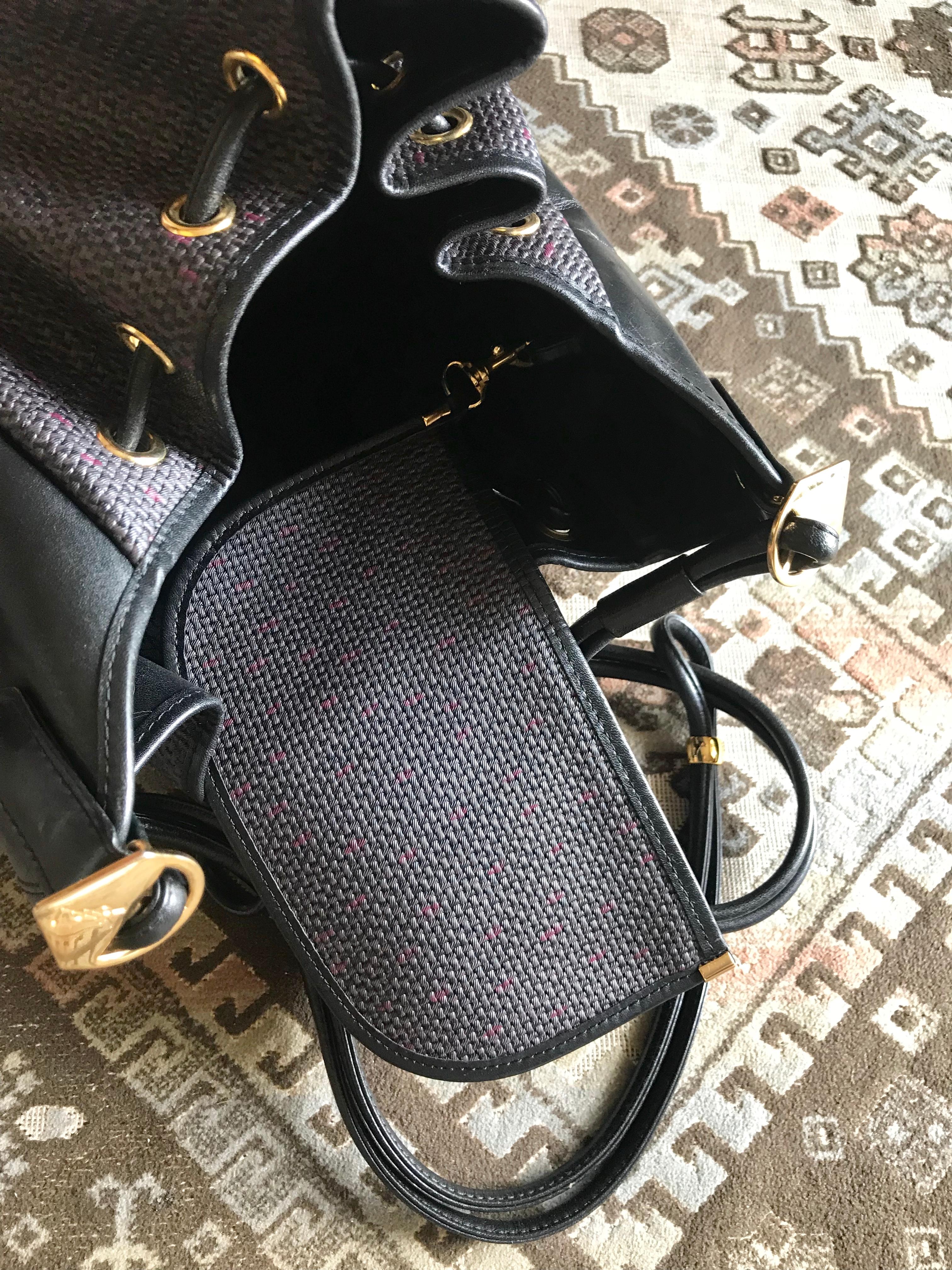Yves Saint Laurent Vintage black hobo bucket shoulder bag with golden YSL motif For Sale 10