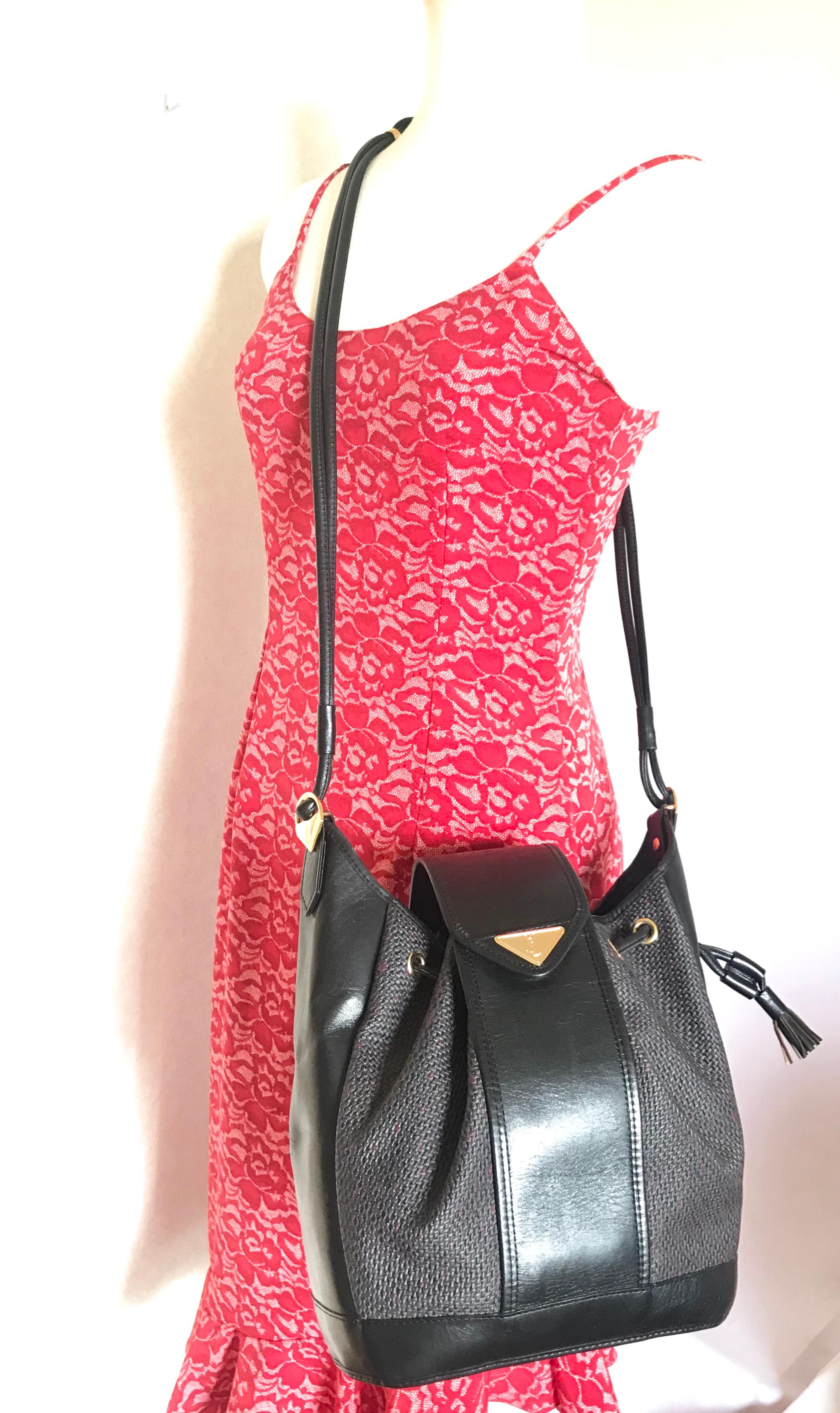 Yves Saint Laurent Vintage black hobo bucket shoulder bag with golden YSL motif For Sale 12