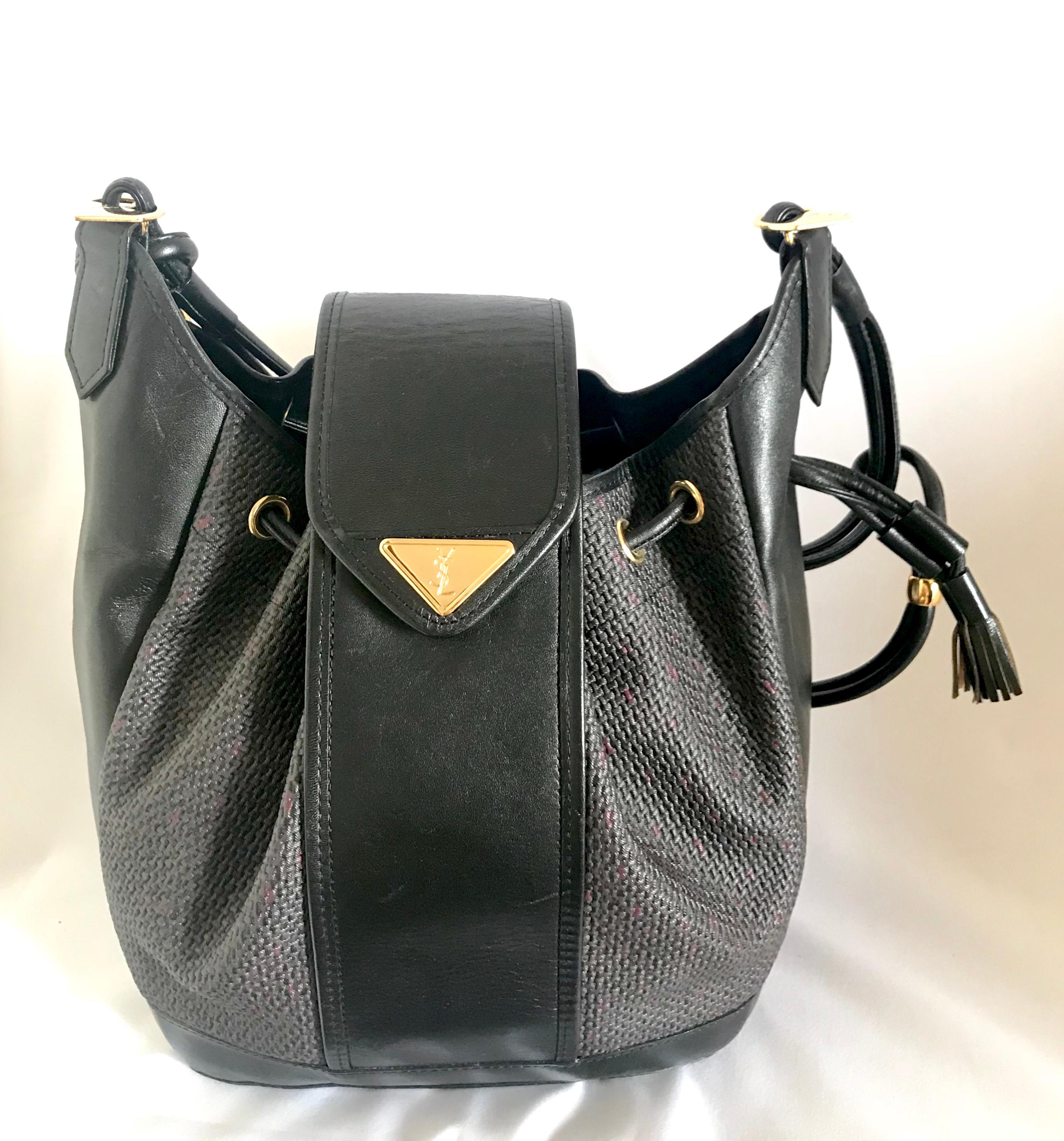 Yves Saint Laurent Vintage black hobo bucket shoulder bag with golden YSL motif For Sale 13