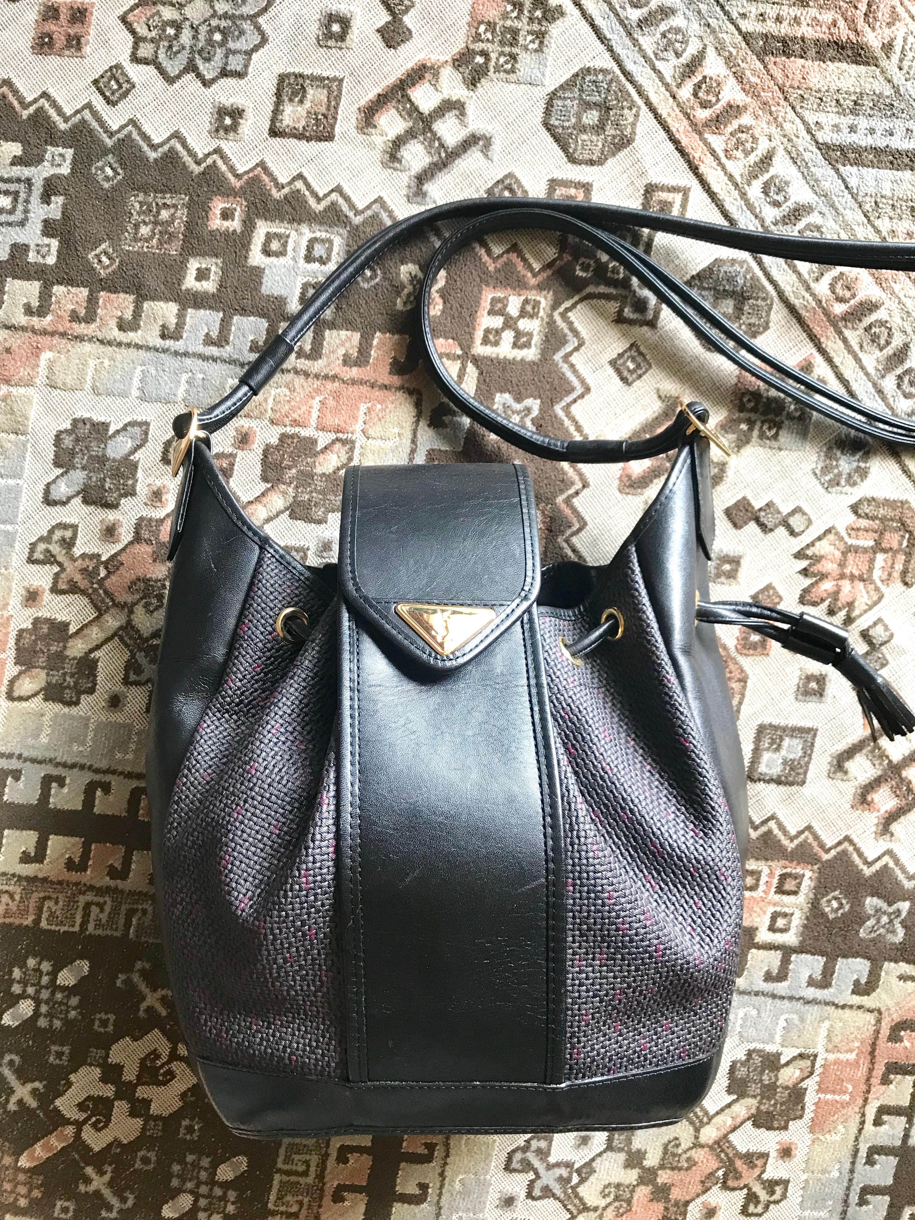 Yves Saint Laurent Vintage black hobo bucket shoulder bag with golden YSL motif For Sale 14