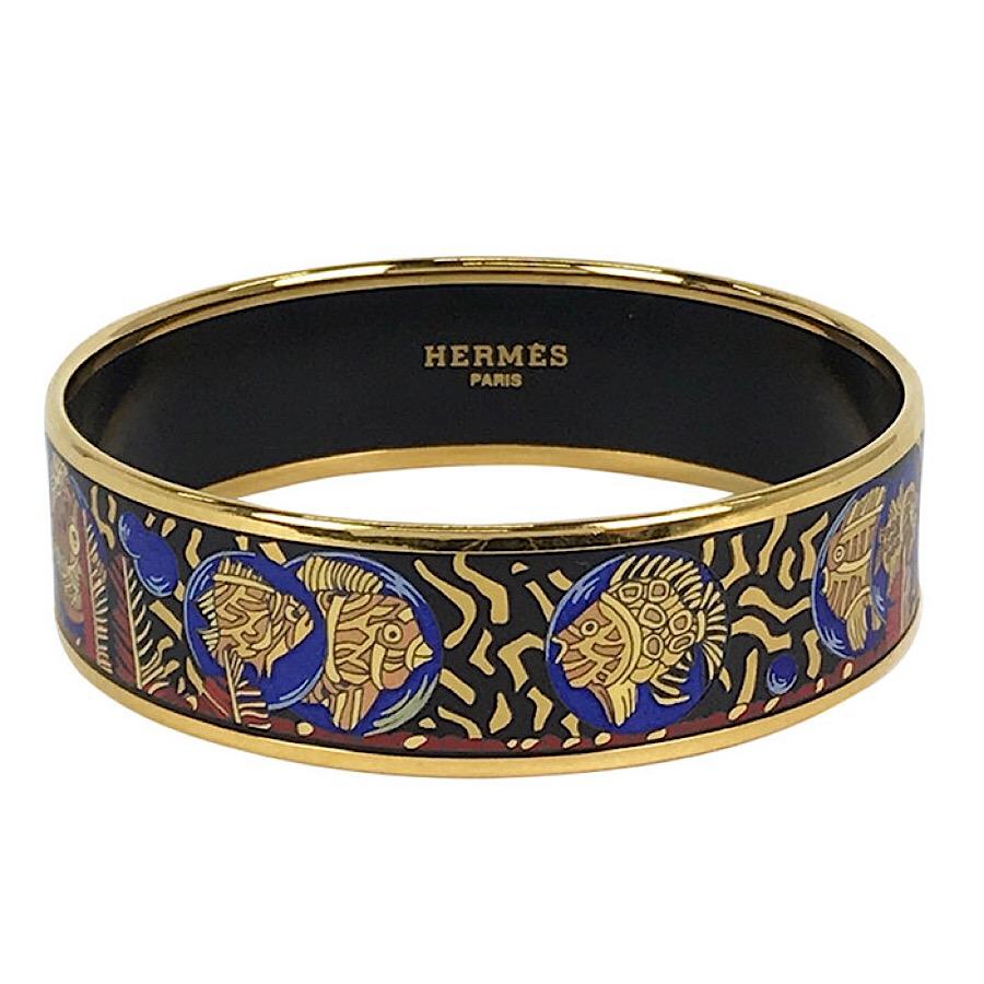 1990s. Vintage Hermes cloisonne enamel yellow and gold fish in blue, black, red bangle bracelet. Classic Hermes jewelry.

Introducing a fantastic jewelry piece  from HERMES....
The iconic cloisonne enamel golden bangle! Perfect jewelry piece for the
