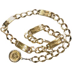 MINT. 80's Vintage CHANEL golden thick chain belt with logo engraved bar motifs.