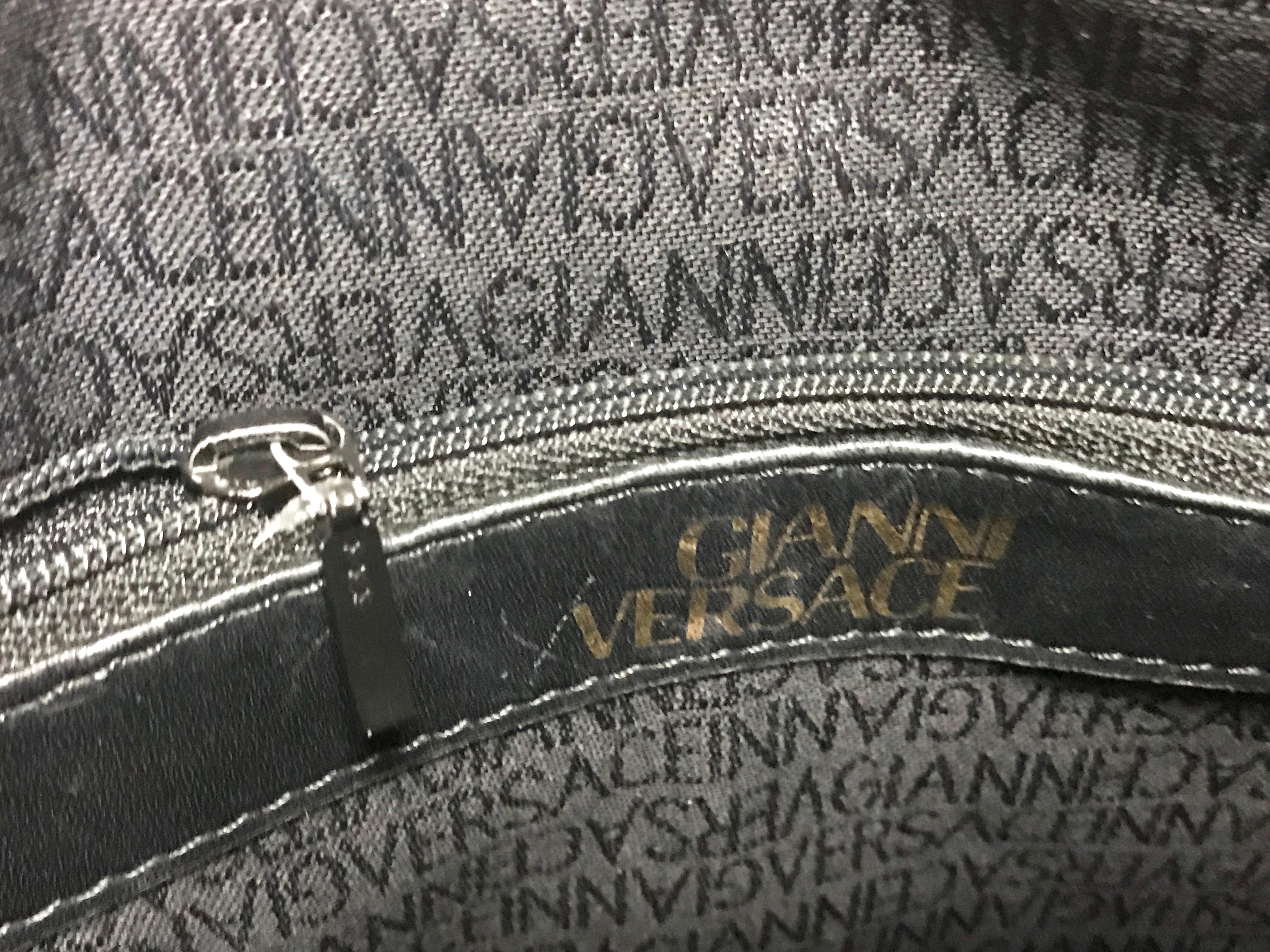 Gianni Versace Vintage black bolide shape bag with a tassel and sunburst motifs  For Sale 9