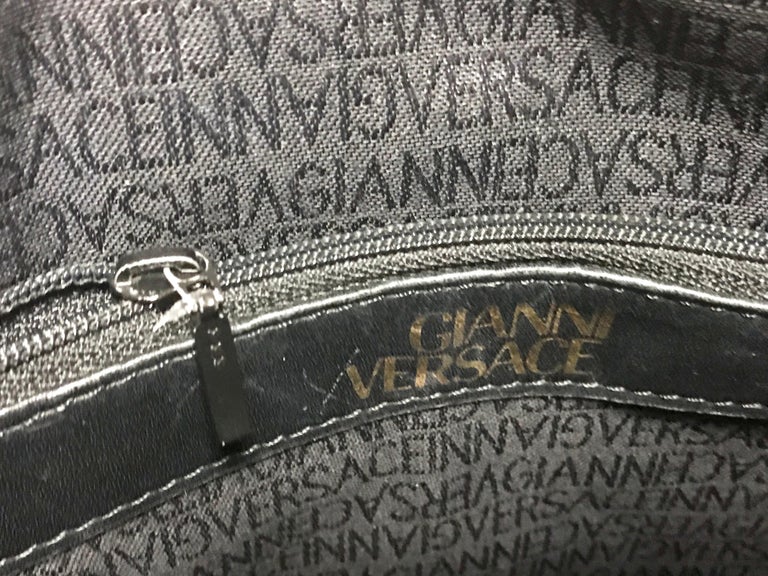 Gianni Versace Vintage black bolide shape bag with a tassel and sunburst motifs  For Sale 10