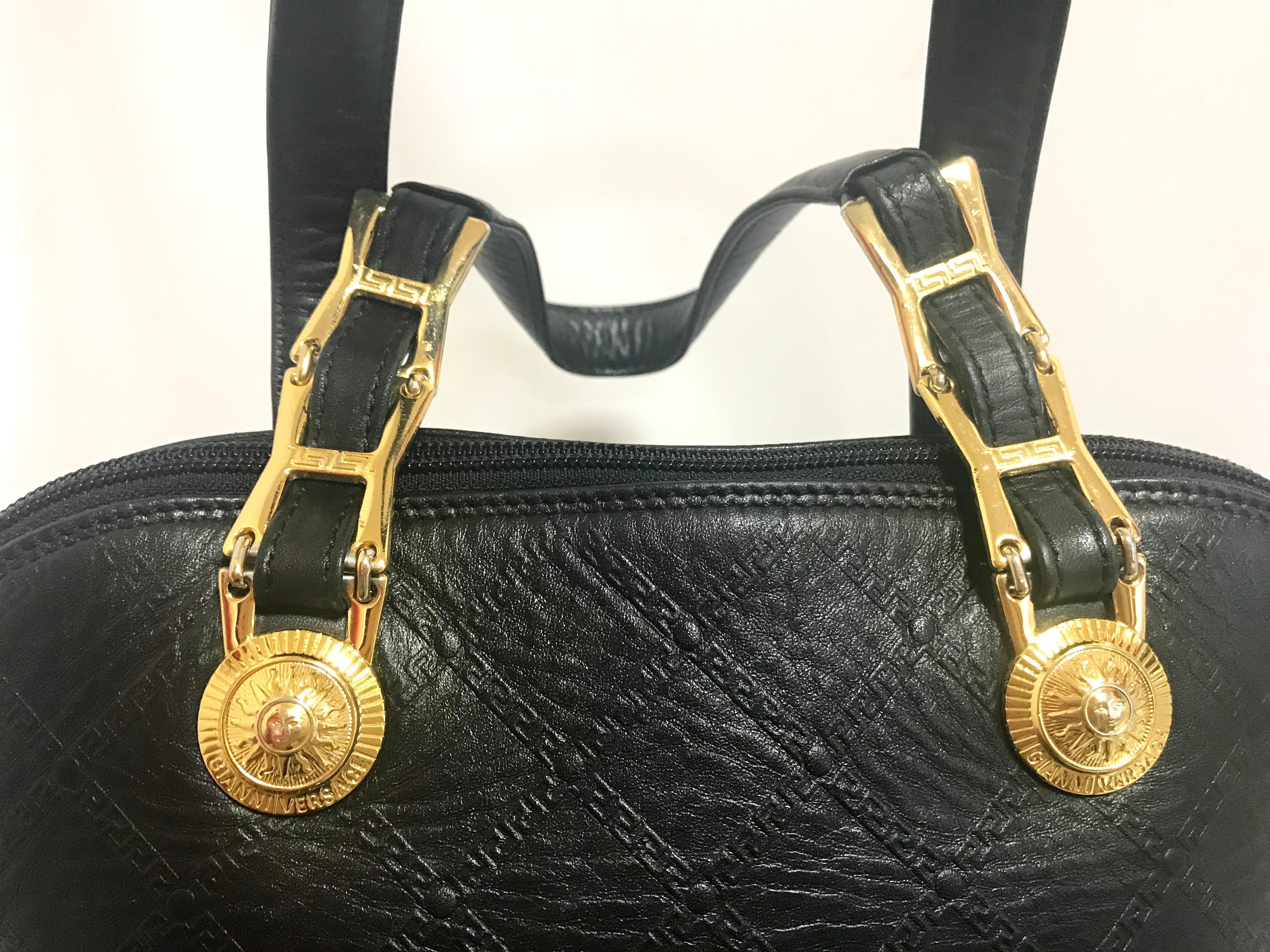 Gianni Versace Vintage black bolide shape bag with a tassel and sunburst motifs  In Good Condition For Sale In Kashiwa, Chiba