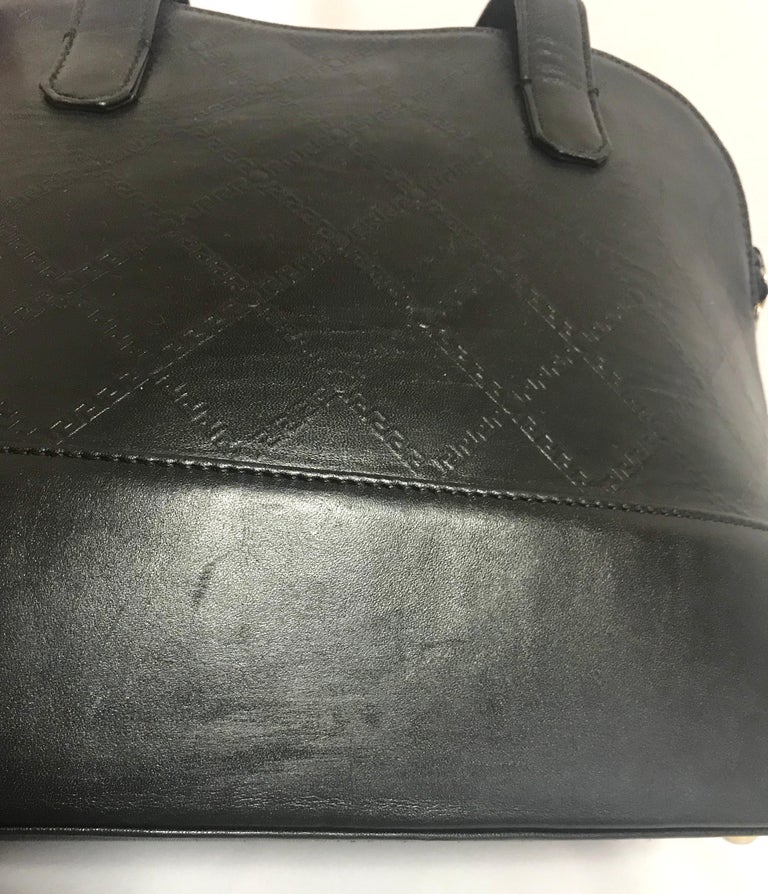 Gianni Versace Vintage black bolide shape bag with a tassel and sunburst motifs  For Sale 2