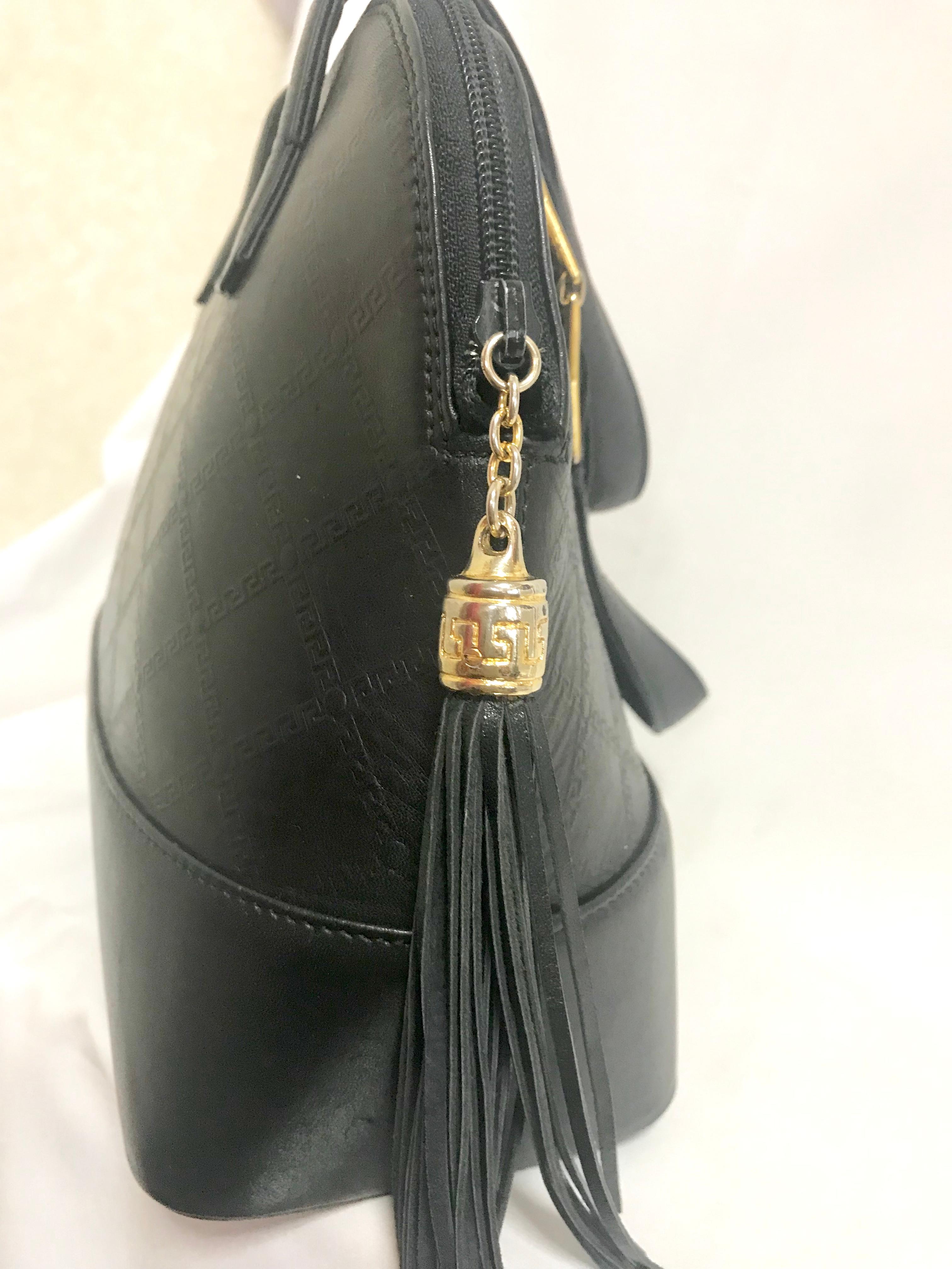 Gianni Versace Vintage black bolide shape bag with a tassel and sunburst motifs  For Sale 3