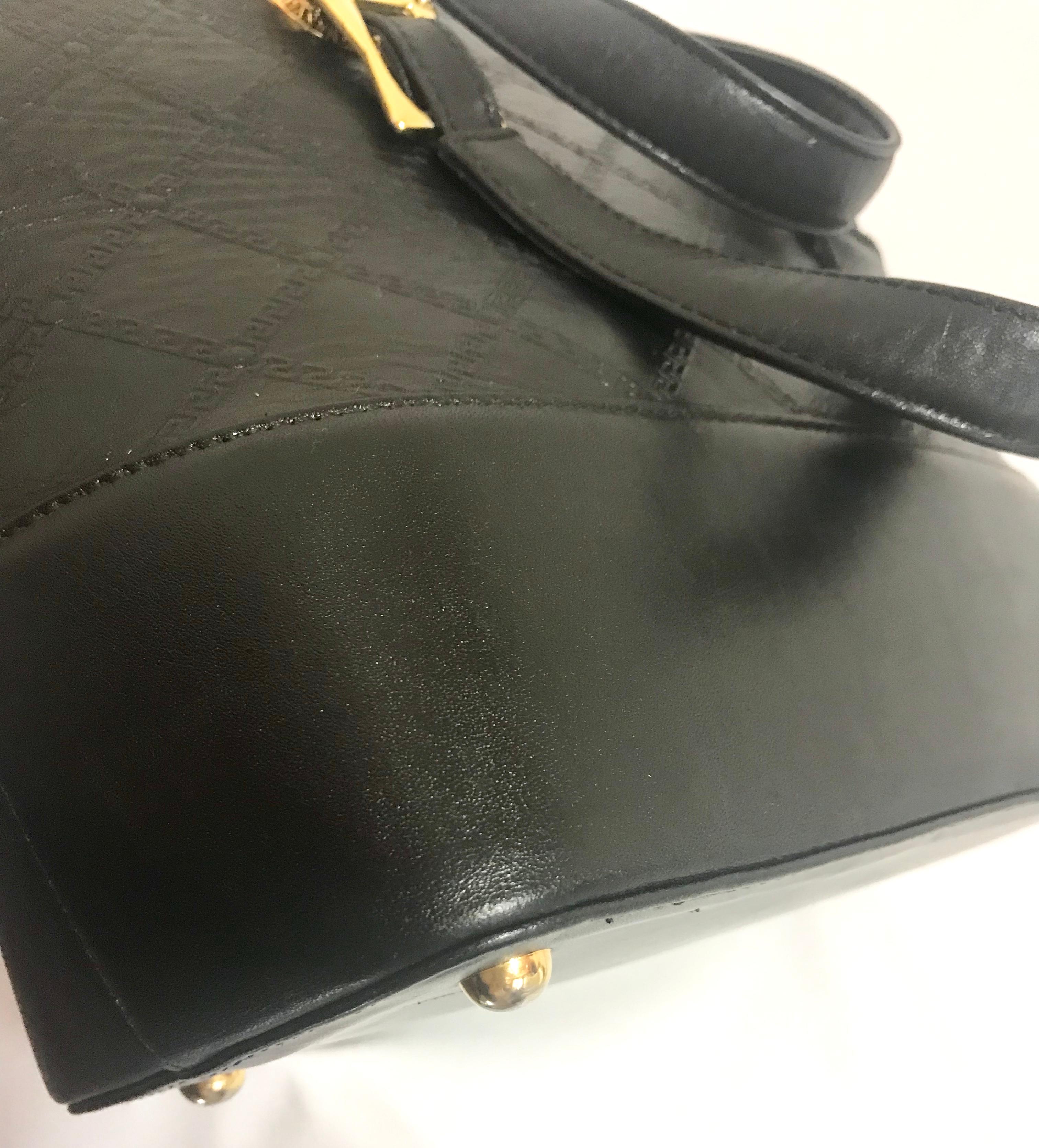 Gianni Versace Vintage black bolide shape bag with a tassel and sunburst motifs  For Sale 5