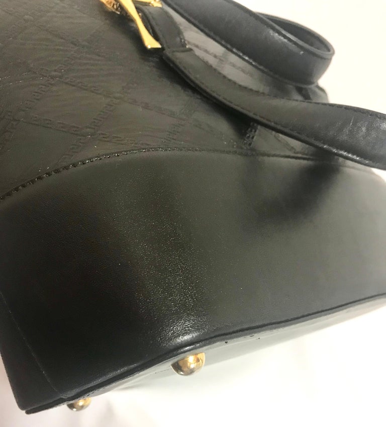 Gianni Versace Vintage black bolide shape bag with a tassel and sunburst motifs  For Sale 6